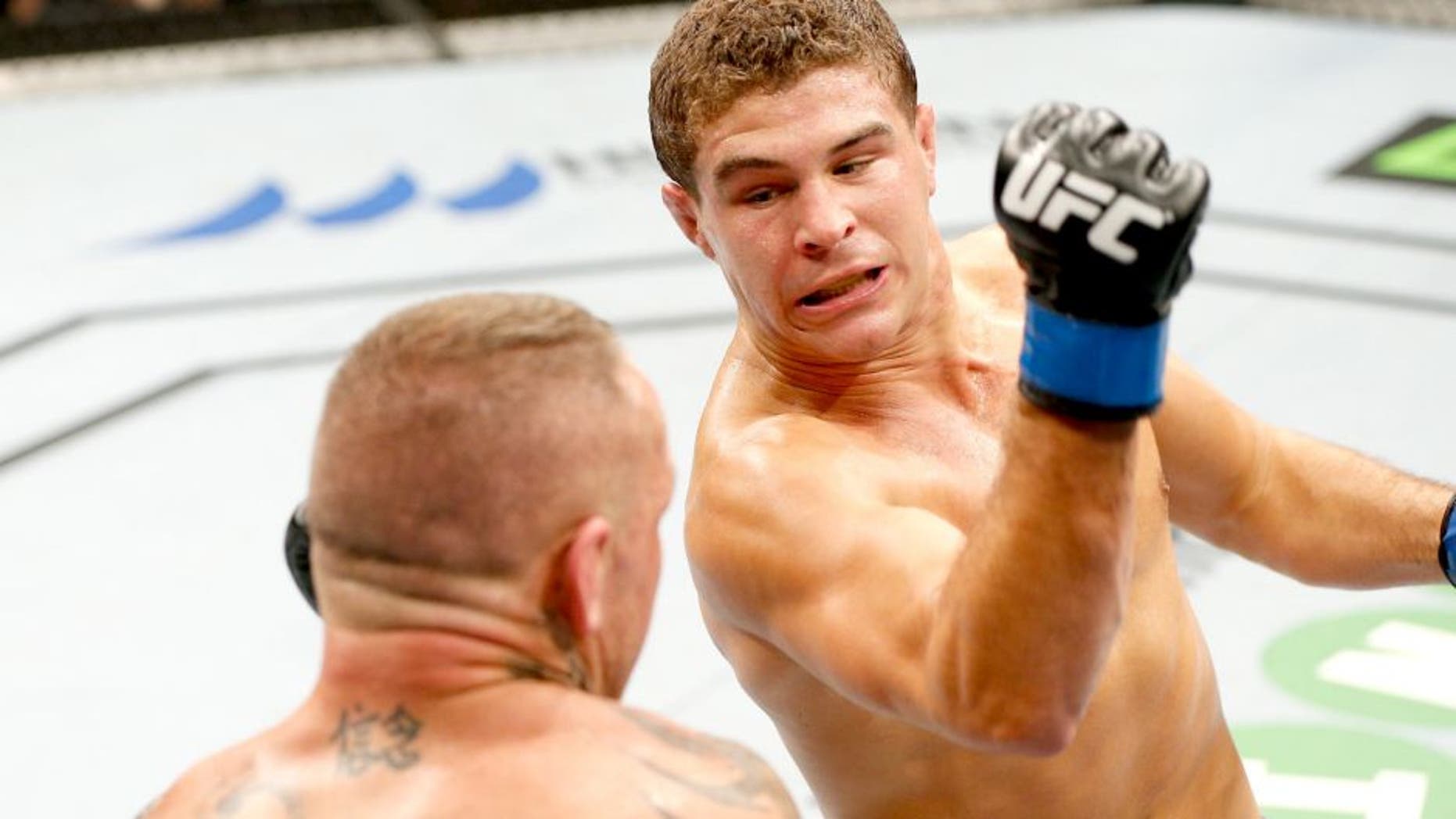 SYDNEY, AUSTRALIA - NOVEMBER 08: (R-L) Al Iaquinta of the United States punches Ross Pearson of England in their lightweight bout during the UFC Fight Night event inside Allphones Arena on November 8, 2014 in Sydney, Australia. (Photo by Josh Hedges/Zuffa LLC/Zuffa LLC via Getty Images)