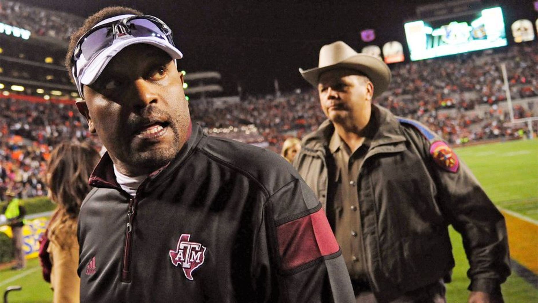 Nov 8, 2014; Auburn, AL, USA; Texas A&M Aggies head coach Kevin Sumlin leaves the field after the game against the Auburn Tigers at Jordan Hare Stadium. Texas A&M won 41-38. Mandatory Credit: Shanna Lockwood-USA TODAY Sports