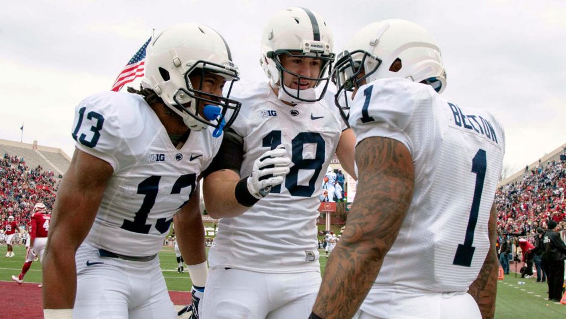 Nov 8, 2014; Bloomington, IN, USA; Penn State Nittany Lions running back Bill Belton (1) celebrates his touchdown with teammates wide receiver Saeed Blacknall (13) and tight end Jesse James (18) in the second quarter of the game at Memorial Stadium. Mandatory Credit: Trevor Ruszkowski-USA TODAY Sports