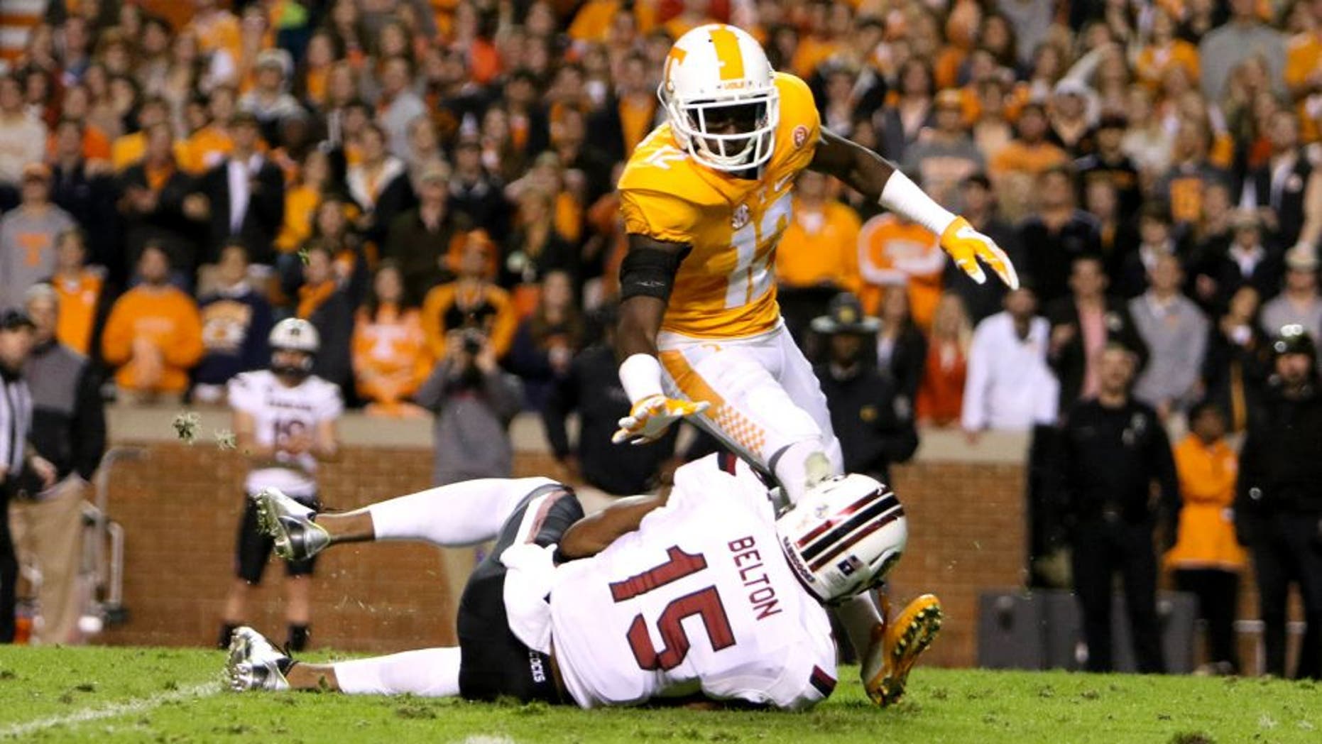 Nov 7, 2015; Knoxville, TN, USA; South Carolina Gamecocks wide receiver Matrick Belton (15) with the ball while defended by Tennessee Volunteers defender Emmanuel Moseley at Neyland Stadium. Mandatory Credit: Randy Sartin-USA TODAY Sports.