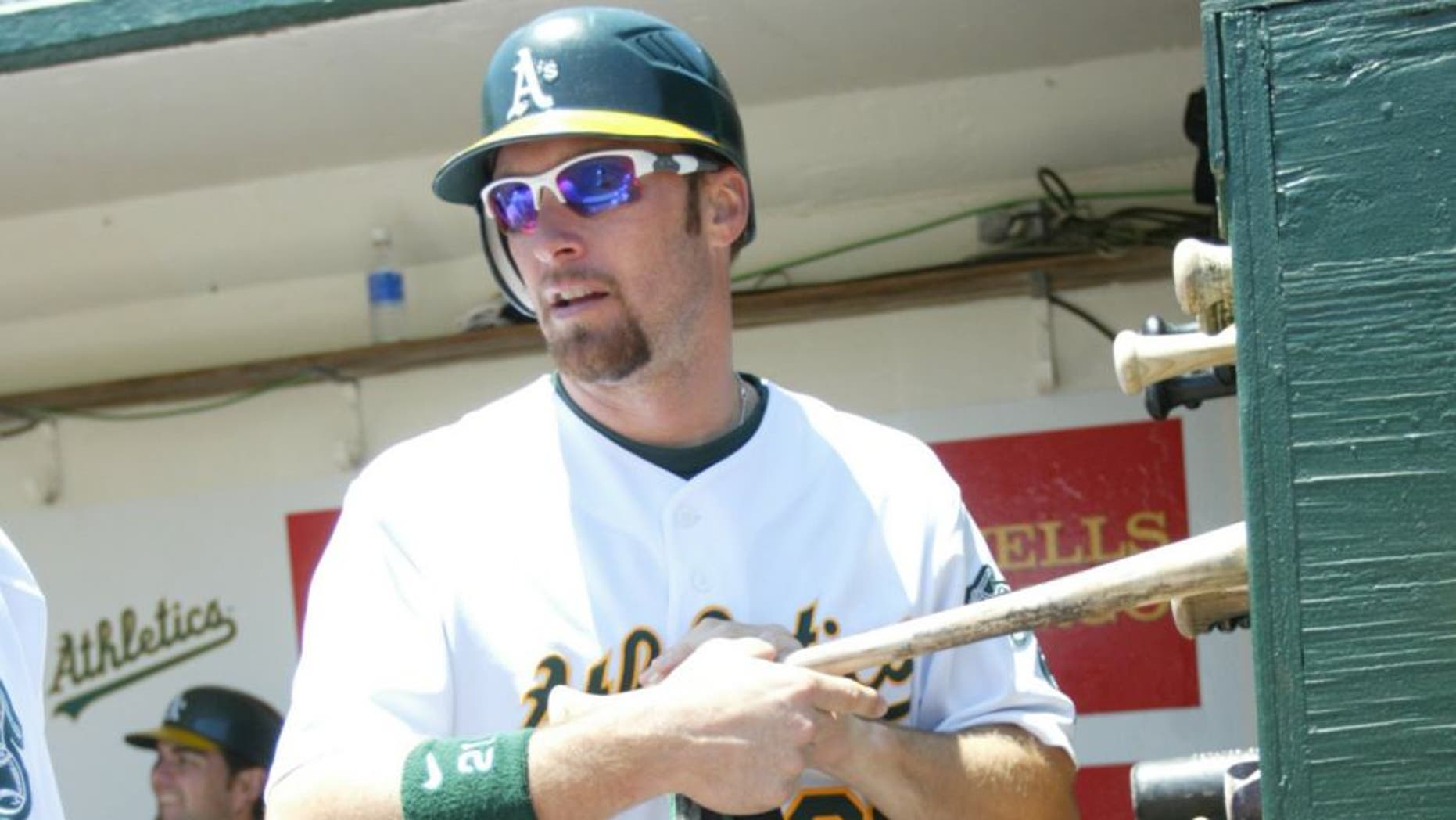 OAKLAND, CA - JUNE 20: Mark Kotsay of the Oakland Athletics selects his bat during the game against the Cincinnati Reds at the McAfee Coliseum in Oakland, California on June 20, 2007. The Reds defeated the Athletics 3-1. (Photo by Michael Zagaris/MLB Photos via Getty Images)