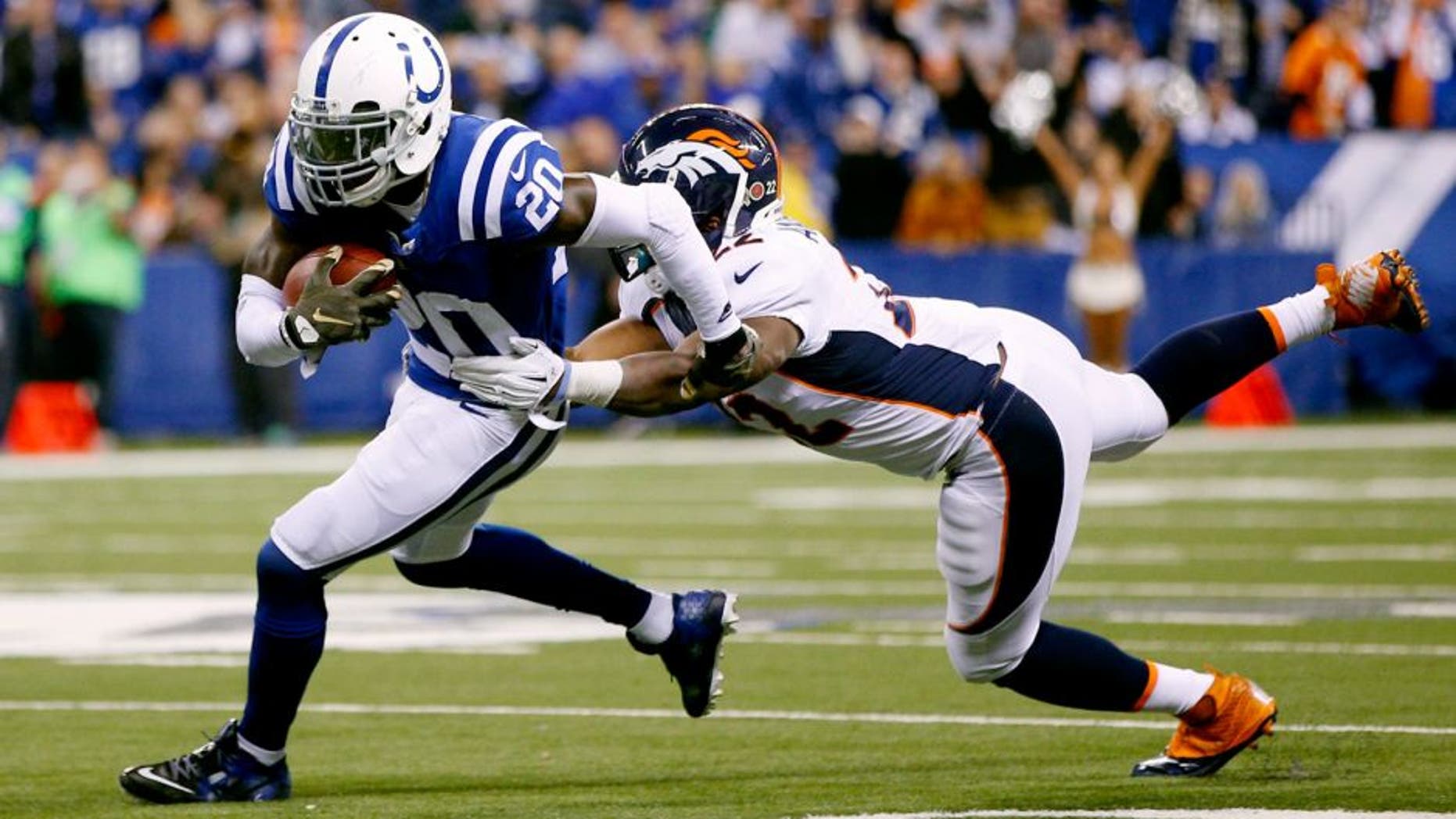 INDIANAPOLIS, IN - NOVEMBER 8: Darius Butler #20 of the Indianapolis Colts returns the ball after intercepting a pass from Peyton Manning #18 of the Denver Broncos in the second half of the game at Lucas Oil Stadium on November 8, 2015 in Indianapolis, Indiana. The Colts defeated the Broncos 27-24. (Photo by Joe Robbins/Getty Images)