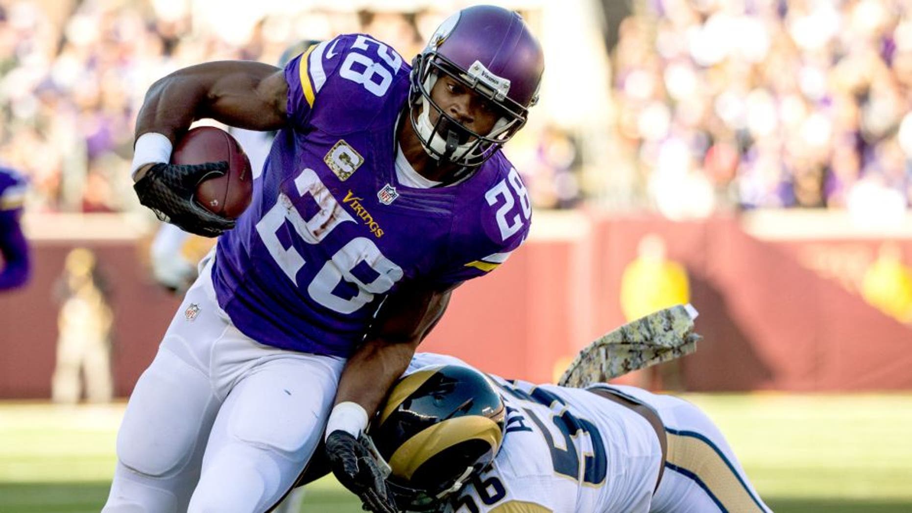 Nov 8, 2015; Minneapolis, MN, USA; Minnesota Vikings running back Adrian Peterson (28) carries the ball during the first quarter against the St. Louis Rams at TCF Bank Stadium. Mandatory Credit: Brace Hemmelgarn-USA TODAY Sports