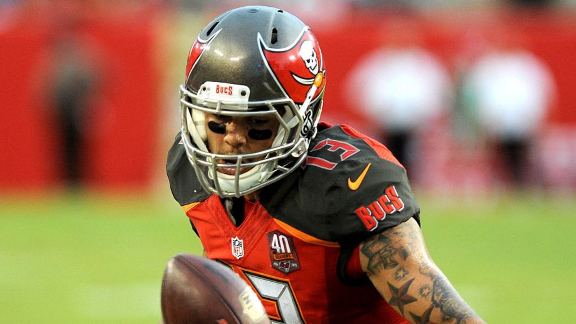 TAMPA, FL - NOVEMBER 8: Wide receiver Mike Evans #13 of the Tampa Bay Buccaneers drops a pass in the second quarter against the New York Giants at Raymond James Stadium on November 8, 2015 in Tampa, Florida. (Photo by Cliff McBride/Getty Images)