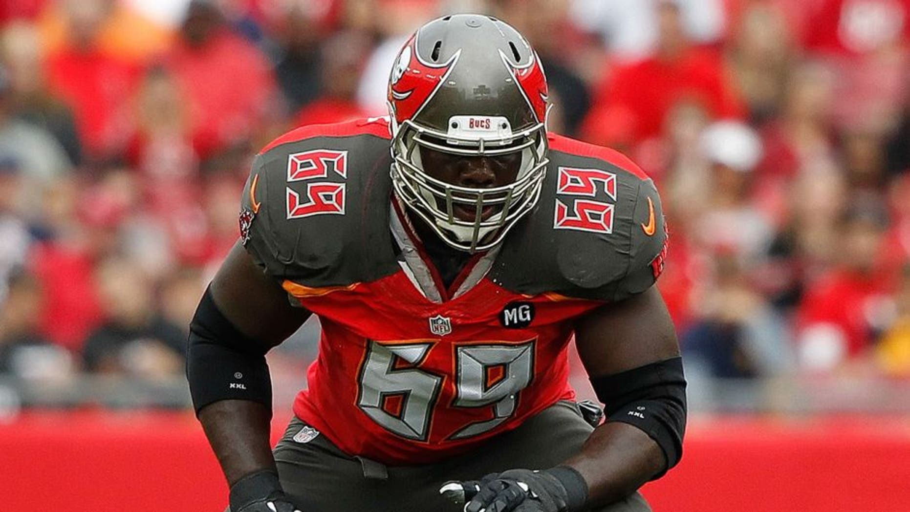 Nov 9, 2014; Tampa, FL, USA;Tampa Bay Buccaneers tackle Demar Dotson (69) blocks against the Atlanta Falcons during the first quarter at Raymond James Stadium. Mandatory Credit: Kim Klement-USA TODAY Sports