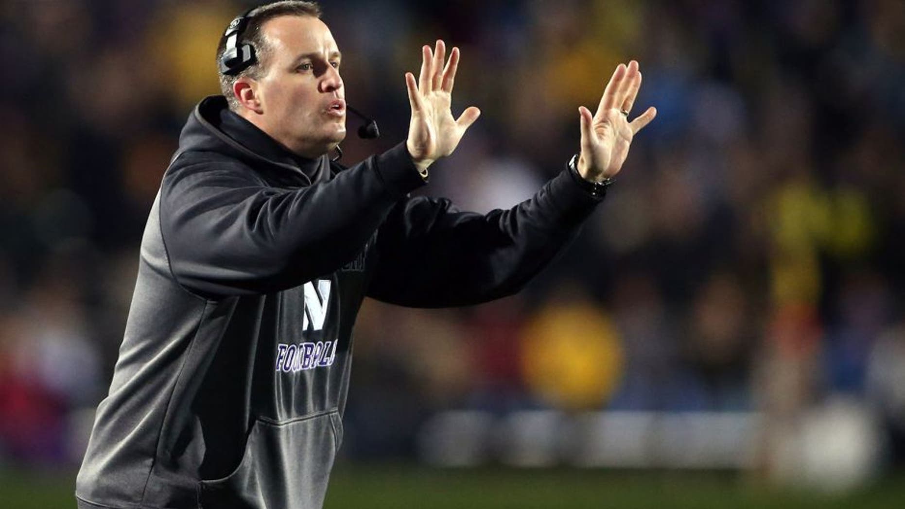 Nov 8, 2014; Evanston, IL, USA; Northwestern Wildcats head coach Pat Fitzgerald gestures to his team in the fourth quarter against the Michigan Wolverines at Ryan Field. Mandatory Credit: Jerry Lai-USA TODAY Sports