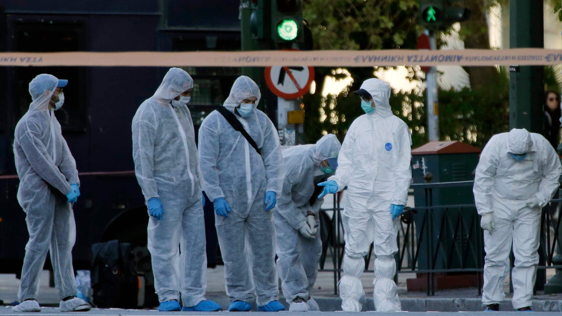 Nov. 10, 2016: Police search for evidence after an explosion outside the French Embassy in Athens.