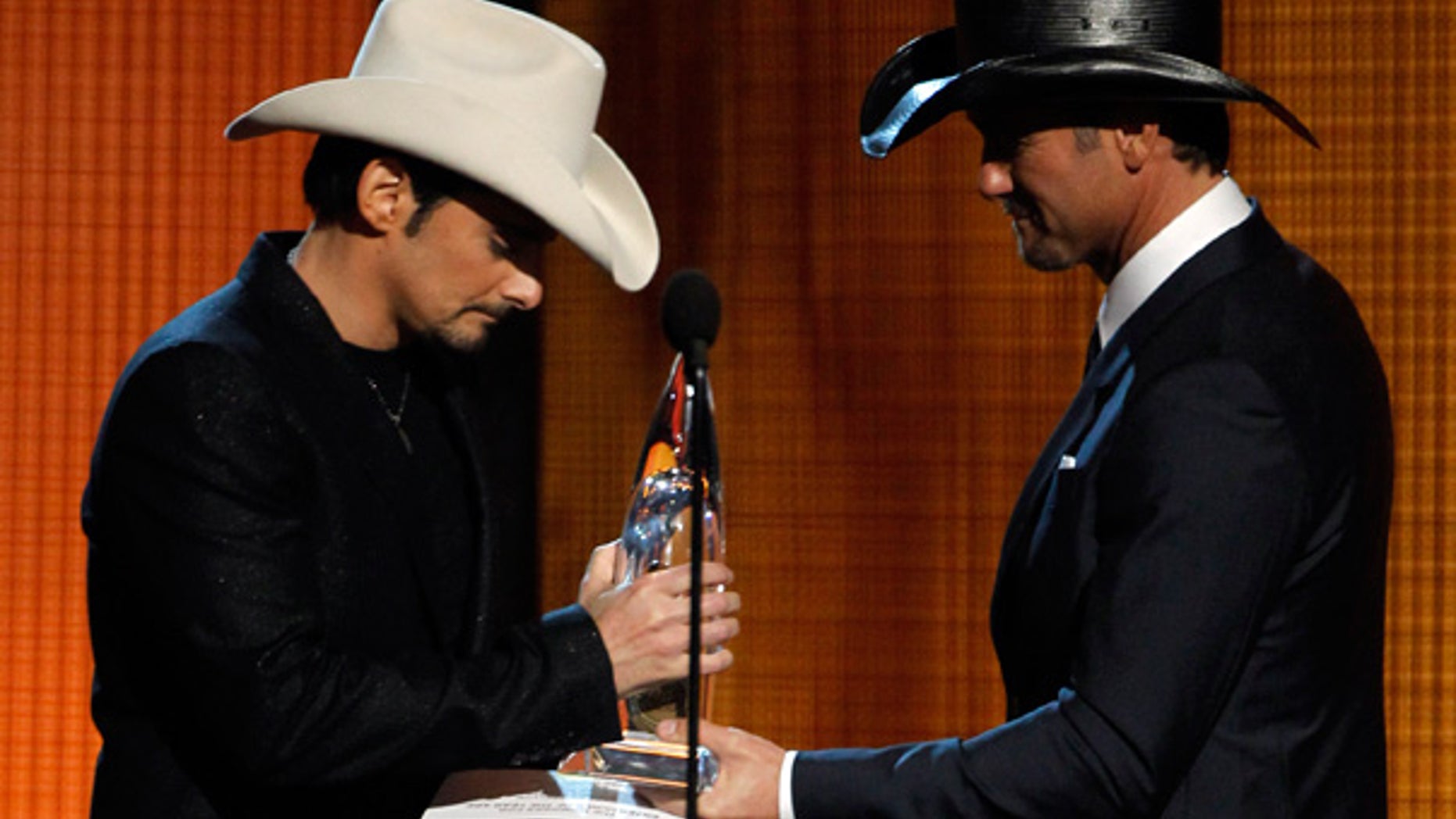 Nov. 10: Brad Paisley, left, accepts the Entertainer of the Year Award from Tim McGraw at the 44th Annual CMAs in Nashville.
