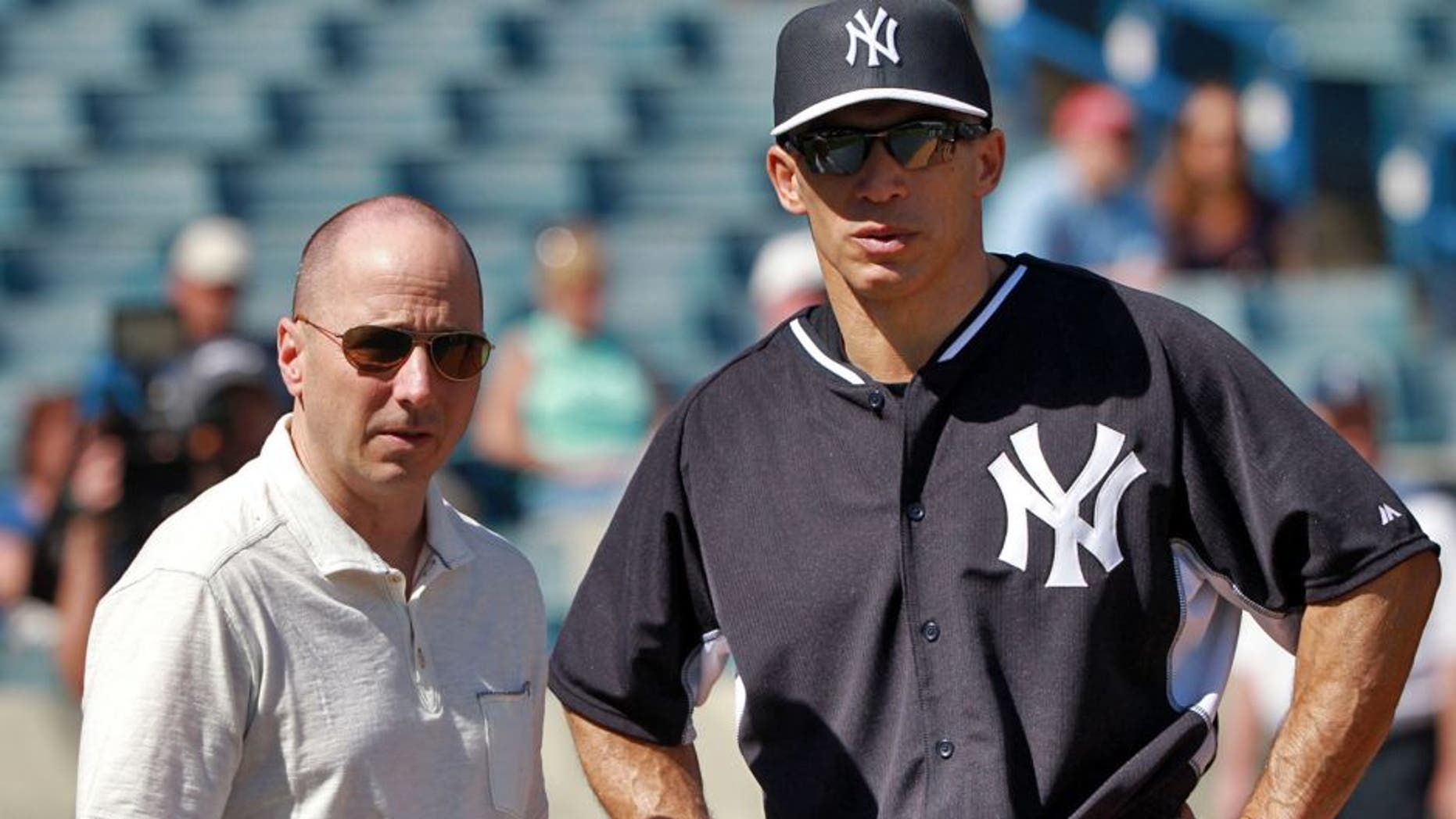 Feb 21, 2015; Tampa, FL, USA; New York Yankees manager Joe Girardi (right) and generial manager Brian Cashman during spring training workouts at George M. Steinbrenner Field. Mandatory Credit: Kim Klement-USA TODAY Sports