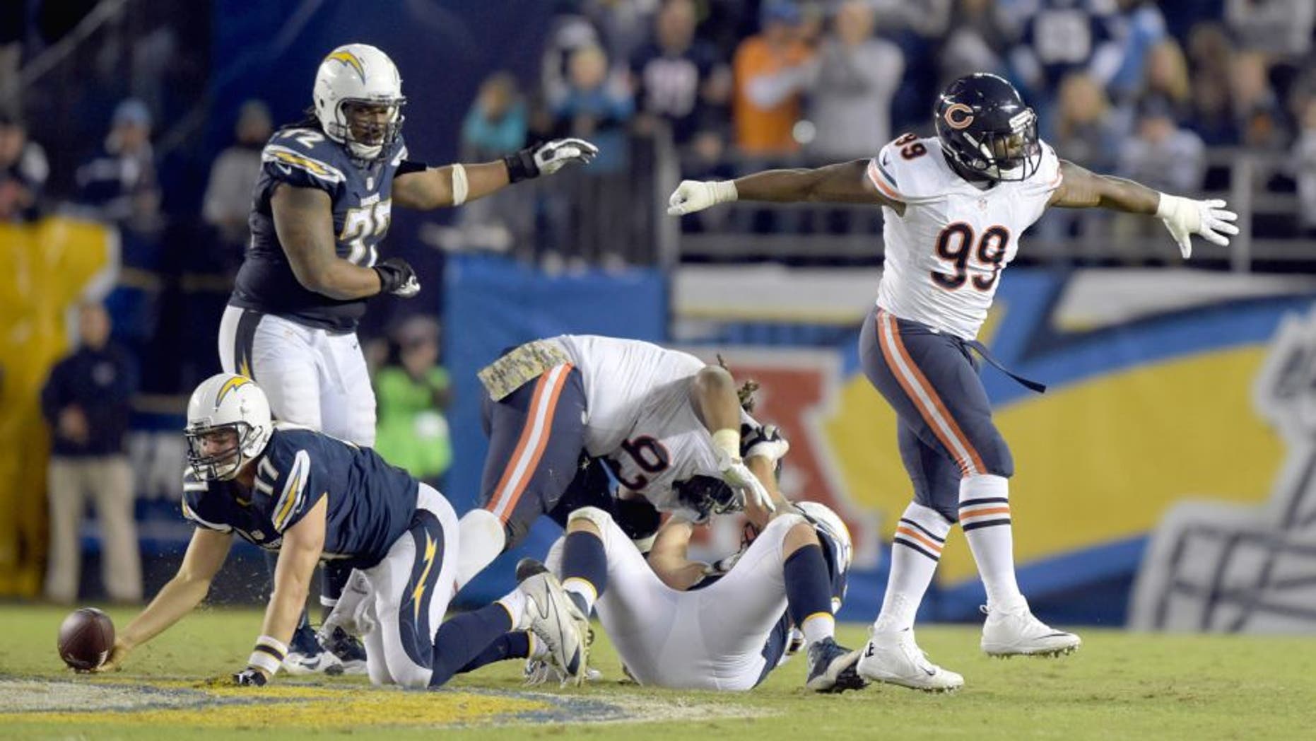 Nov 9, 2015; San Diego, CA, USA; Chicago Bears linebacker Lamarr Houston (99) celebrates after sacking San Diego Chargers quarterback Philip Rivers (17) in the fourth quarter in a NFL football game at Qualcomm Stadium. Mandatory Credit: Kirby Lee-USA TODAY Sports