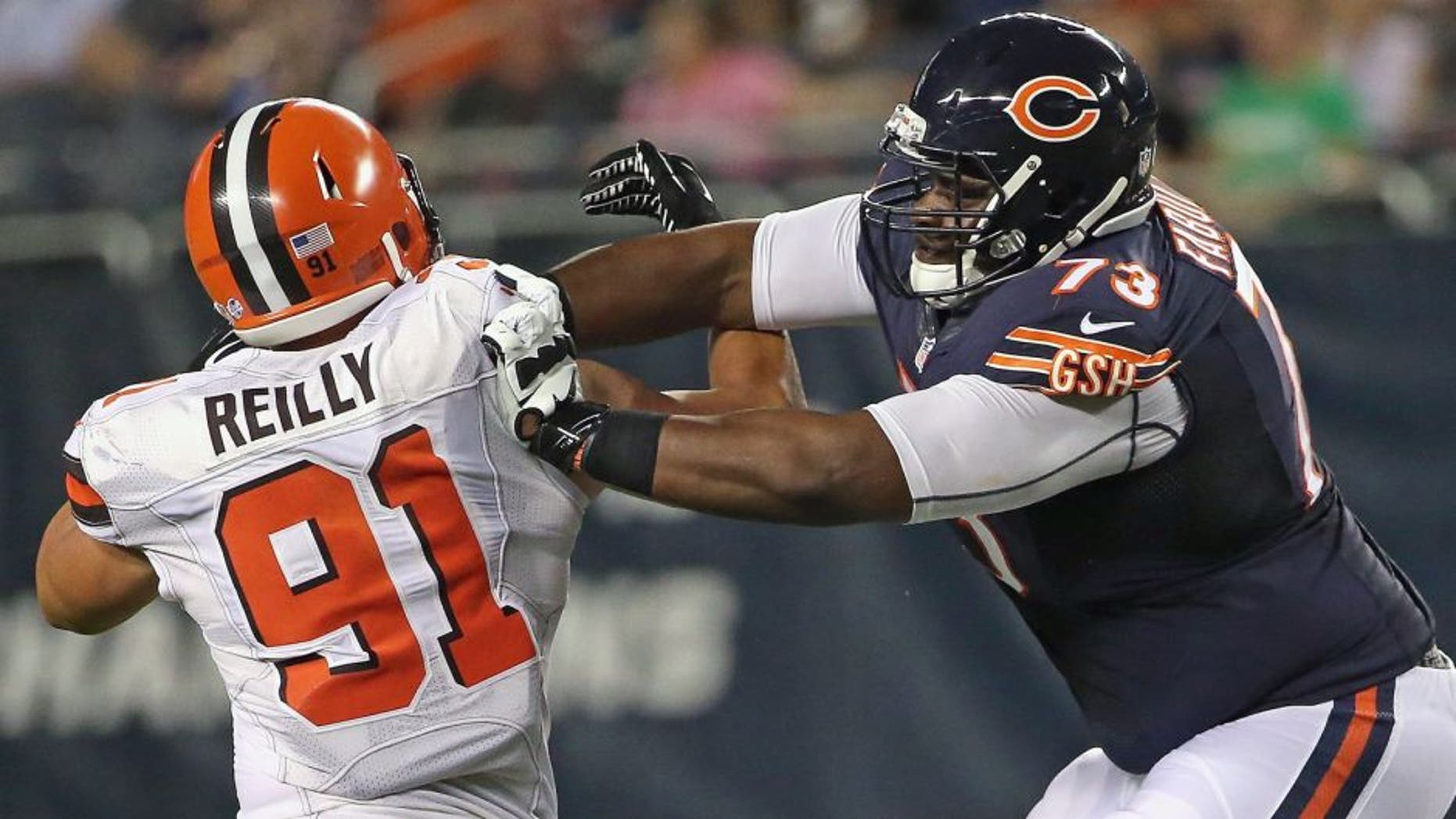 CHICAGO, IL - SEPTEMBER 03: Tayo Fabuluje #73 of the Chicago Bears blocks Mike Reilly #91 of the Cleveland Browns during a preseason game at Soldier Field on September 3, 2015 in Chicago, Illinois. The Bears defeated the Browns 24-0. (Photo by Jonathan Daniel/Getty Images)