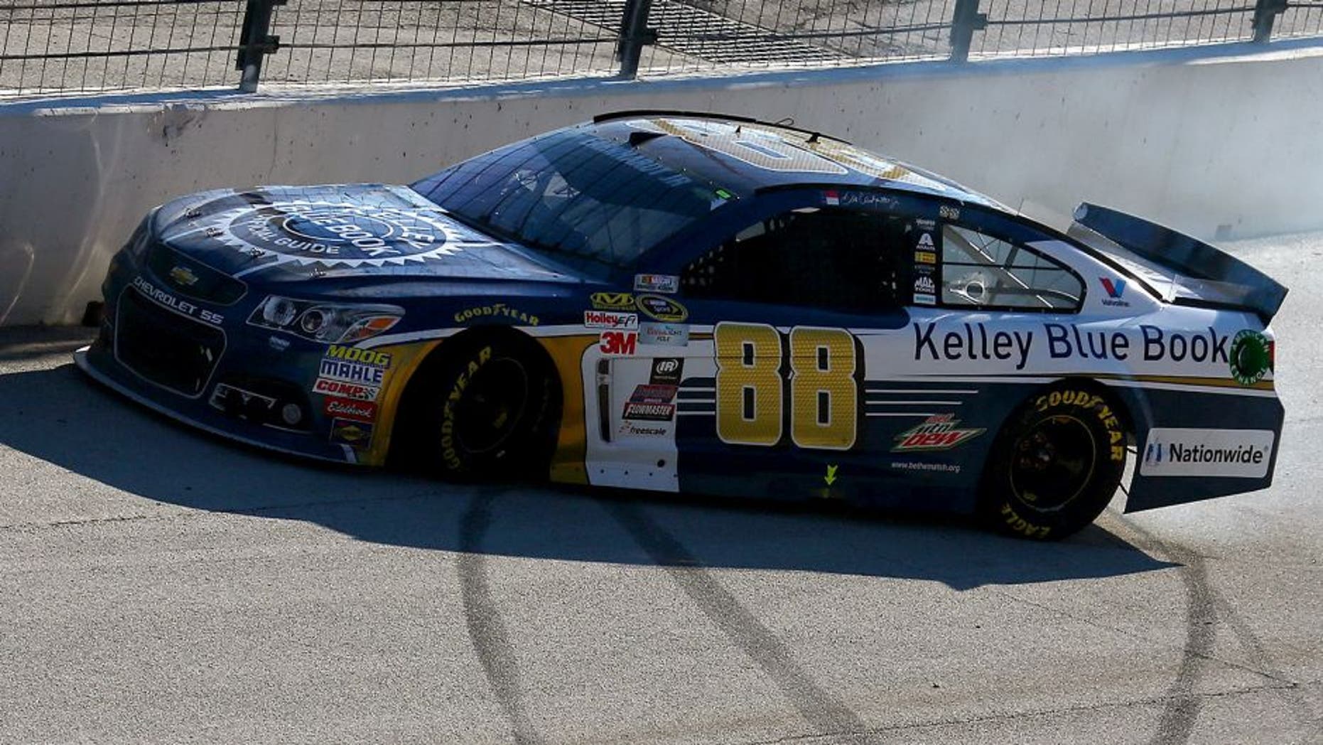 FORT WORTH, TX - NOVEMBER 08: Dale Earnhardt Jr., driver of the #88 Kelley Blue Book Chevrolet, spins during the NASCAR Sprint Cup Series AAA Texas 500 at Texas Motor Speedway on November 8, 2015 in Fort Worth, Texas. (Photo by Tom Pennington/Getty Images)