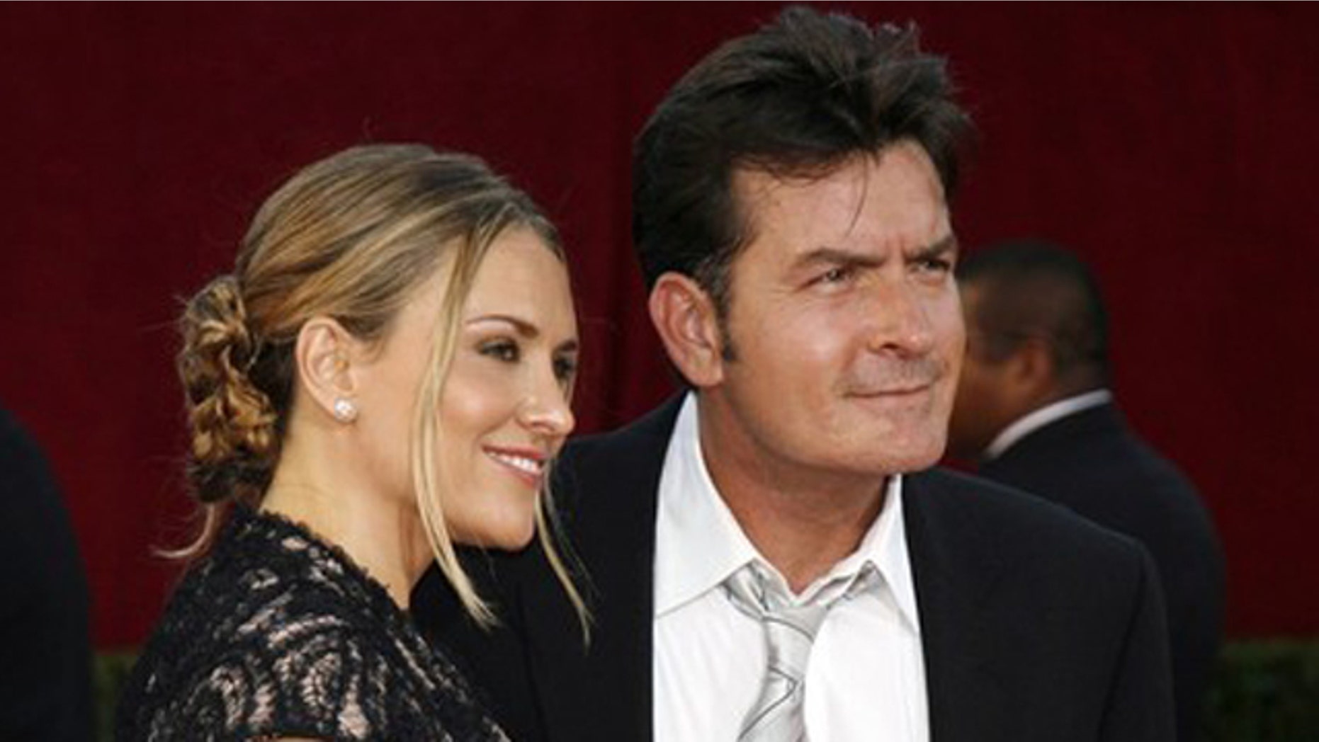 Actor Charlie Sheen and his wife Brooke Mueller arrive at the 61st annual Primetime Emmy Awards in Los Angeles, California in this September 20, 2009 file photo.