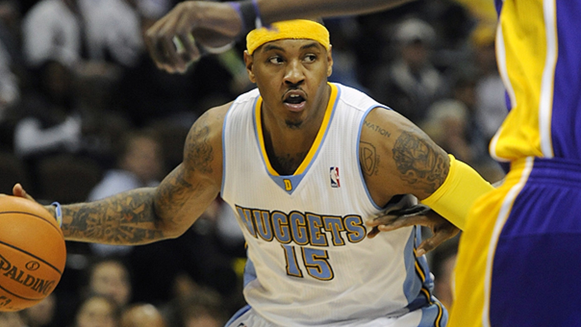 Nov. 11: Denver Nuggets forward Carmelo Anthony brings the ball up the floor in the second half of an NBA basketball game against the Los Angeles Lakers in Denver.