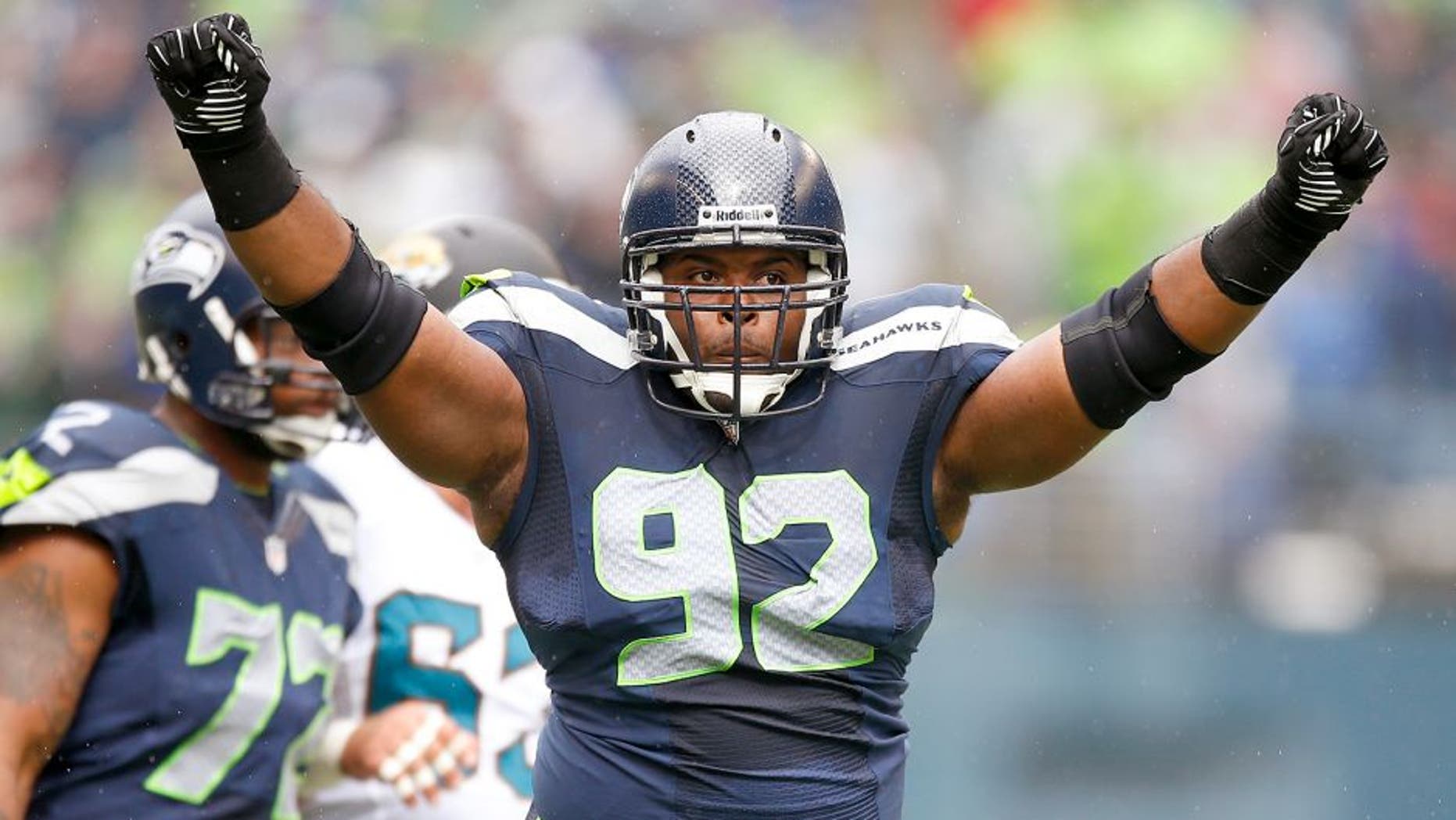 SEATTLE, WA - SEPTEMBER 22: Defensive tackle Brandon Mebane #92 of the Seattle Seahawks celebrates a tackle in the first half against the Jacksonville Jaguars at CenturyLink Field on September 22, 2013 in Seattle, Washington. (Photo by Otto Greule Jr/Getty Images)