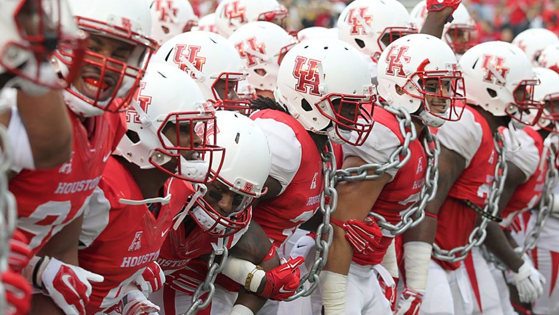 Nov 7, 2015; Houston, TX, USA; The Houston Cougars players fire up the crowd prior to their game against the Cincinnati Bearcats at TDECU Stadium. The Cougars won 33-30. Mandatory Credit: Thomas B. Shea-USA TODAY Sports