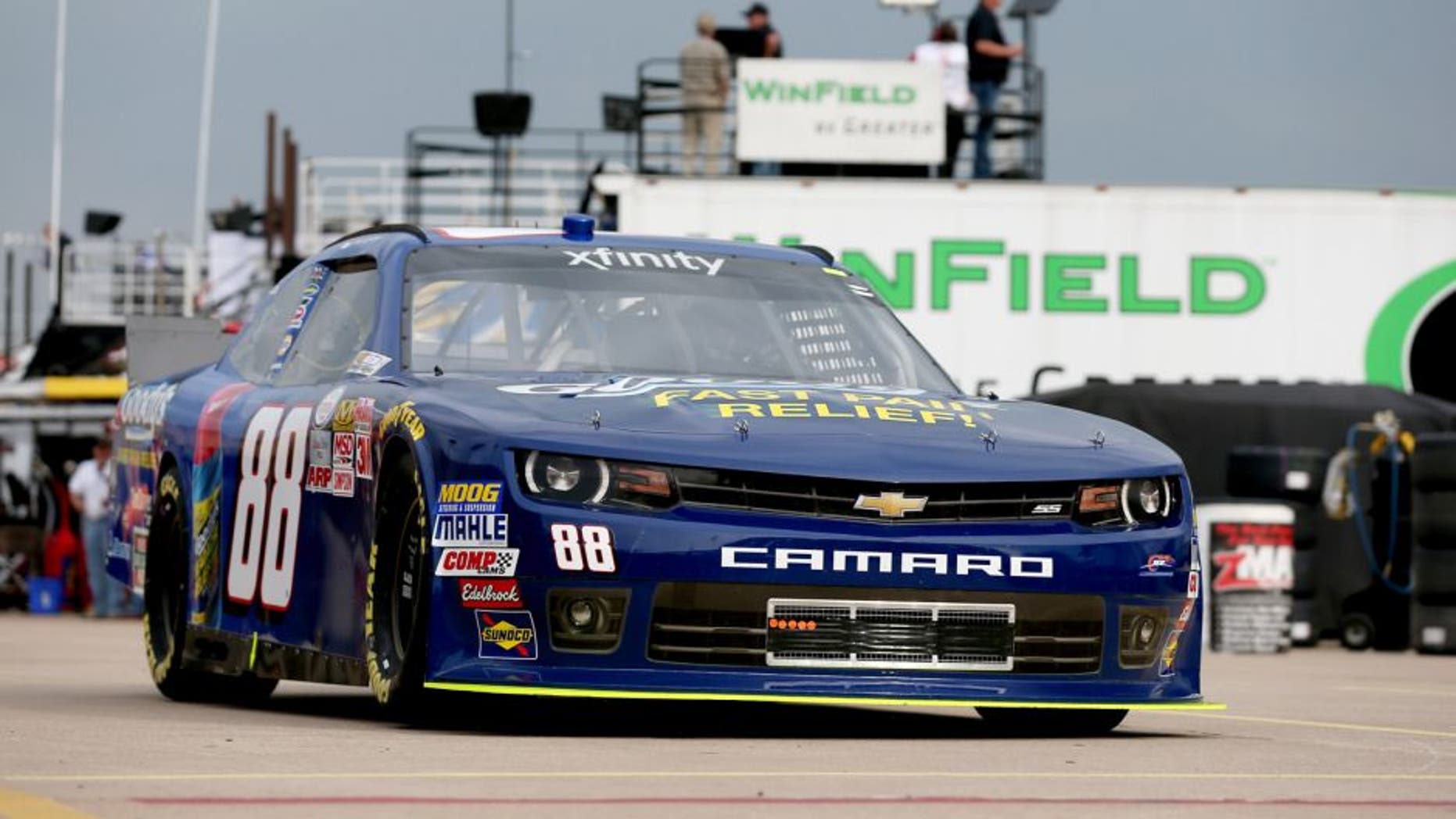 FORT WORTH, TX - APRIL 09: Dale Earnhardt Jr., driver of the #88 Goody's Chevrolet, goes through the garage area during practice for the NASCAR XFINITY Series O'Reilly Auto Parts 300 at Texas Motor Speedway on April 9, 2015 in Fort Worth, Texas. (Photo by Sarah Glenn/Getty Images for Texas Motor Speedway)