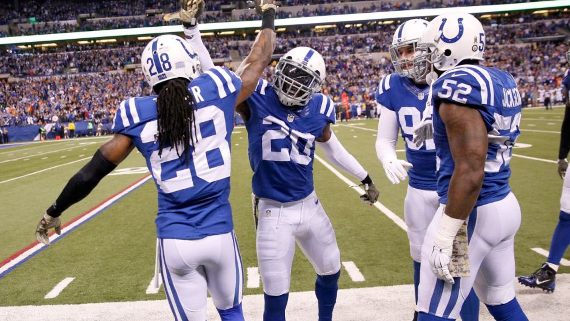 Nov 8, 2015; Indianapolis, IN, USA; Indianapolis Colts cornerback Darius Butler (20) is congratulated by his teammates after making an interception against the Denver Broncos in the 4th quarter at Lucas Oil Stadium. Indianapolis defeats Denver 27-24. Mandatory Credit: Brian Spurlock-USA TODAY Sports