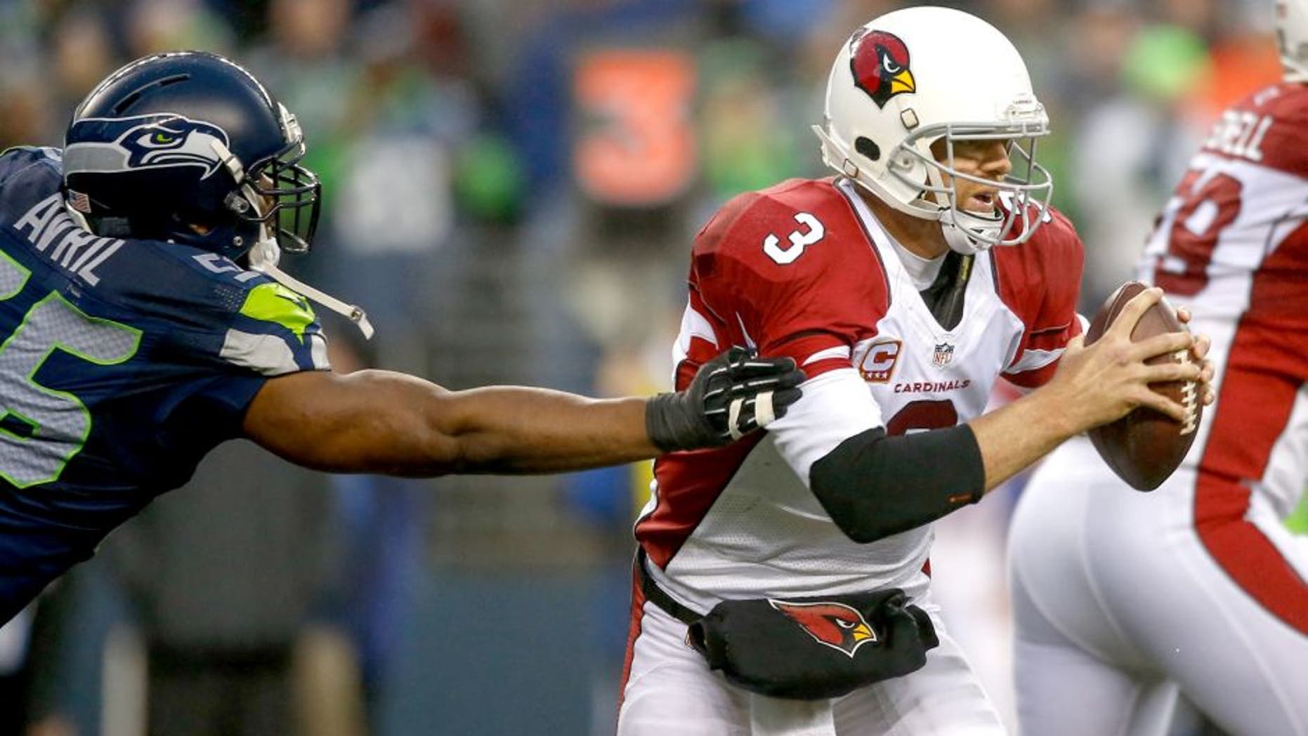 SEATTLE, WA - DECEMBER 22: Quarterback Carson Palmer #3 of the Arizona Cardinals rushes against the Seattle Seahawks at CenturyLink Field on December 22, 2013 in Seattle, Washington. (Photo by Otto Greule Jr/Getty Images)
