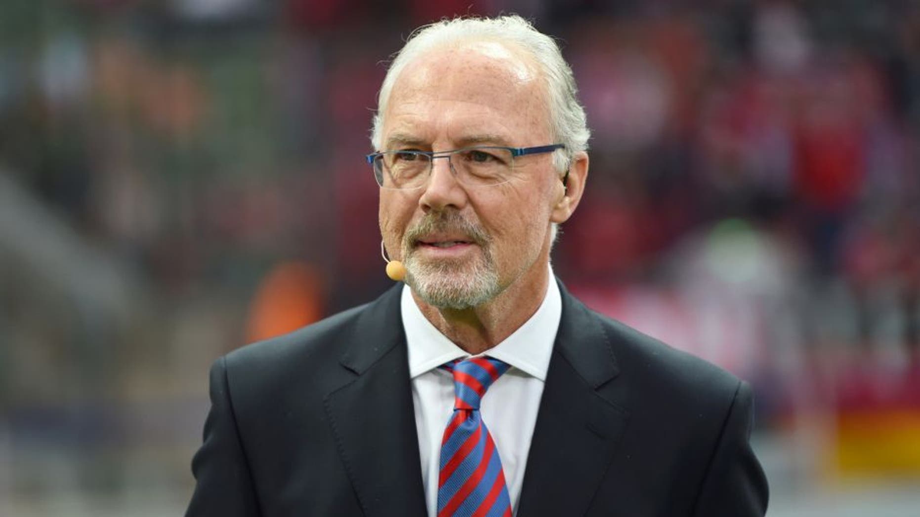 German football legend Franz Beckenbauer attends the DFB German Cup final football match BVB Borussia Dortmund vs Bayern Munich at the Olympic Stadium in Berlin on May 17, 2014. AFP PHOTO / PATRIK STOLLARZ RESTRICTIONS / EMBARGO ACCORDING TO DFB RULES IMAGE SEQUENCES TO SIMULATE VIDEO IS NOT ALLOWED DURING MATCH TIME. MOBILE (MMS) USE IS NOT ALLOWED DURING AND FOR FURTHER TWO HOURS AFTER THE MATCH. FOR MORE INFORMATION CONTACT DFB DIRECTLY AT +49 69 67880 (Photo credit should read PATRIK STOLLARZ/AFP/Getty Images)