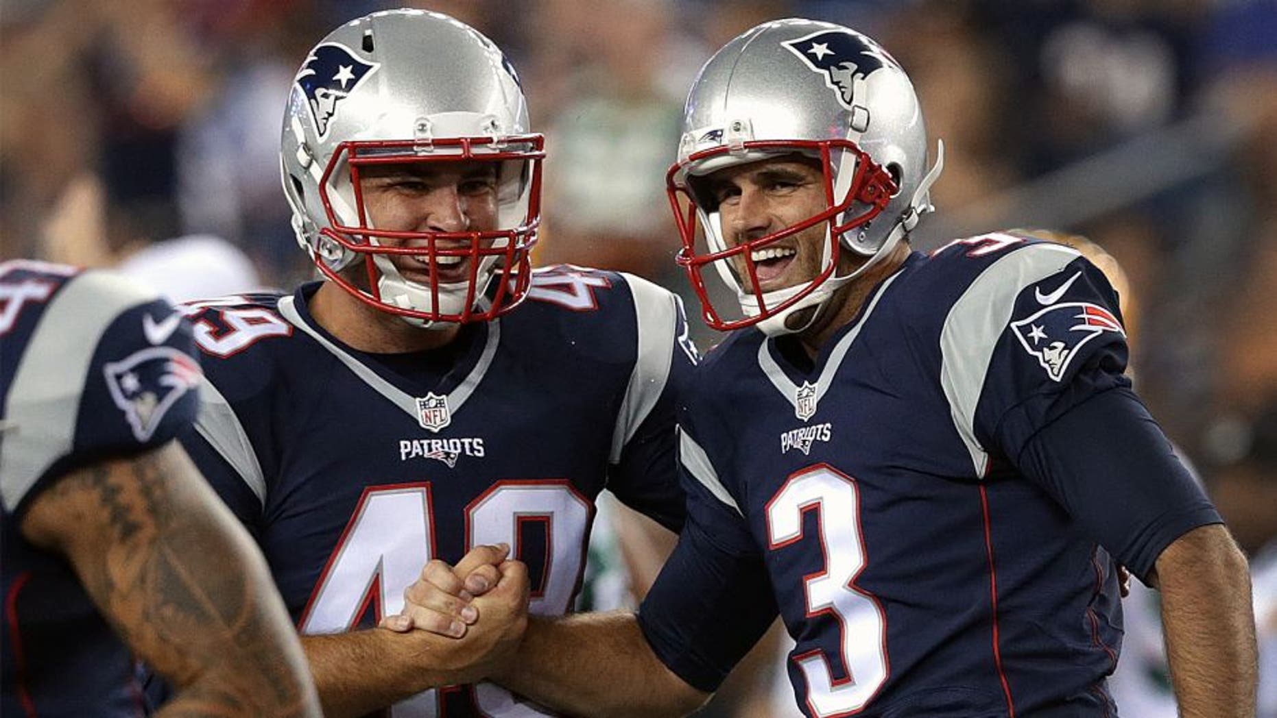 FOXBOROUGH, MA - AUGUST 13: (2nd quarter) New England Patriots kicker Stephen Gostkowski (3) and New England Patriots long snapper Joe Cardona (49) celebrate after Gostkowski kicked a 56 yard field goal at the end of the second quarter. The New England Patriots played the Green Bay Packers in an exhibition game at Gillette Stadium in Foxborough, Mass. on Aug. 13, 2015. (Photo by Barry Chin/The Boston Globe via Getty Images)