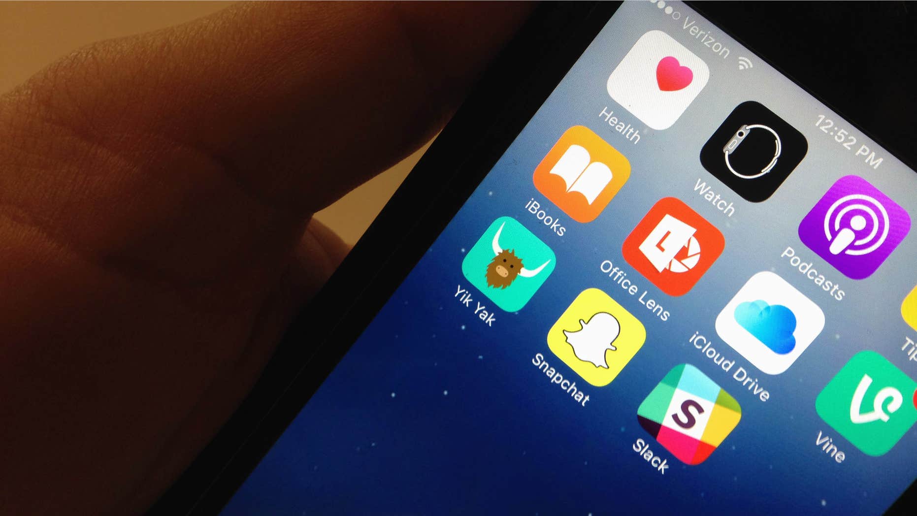 Nov. 11, 2015: The Yik Yak app, lower, left, is seen on an iPhone in Washington.