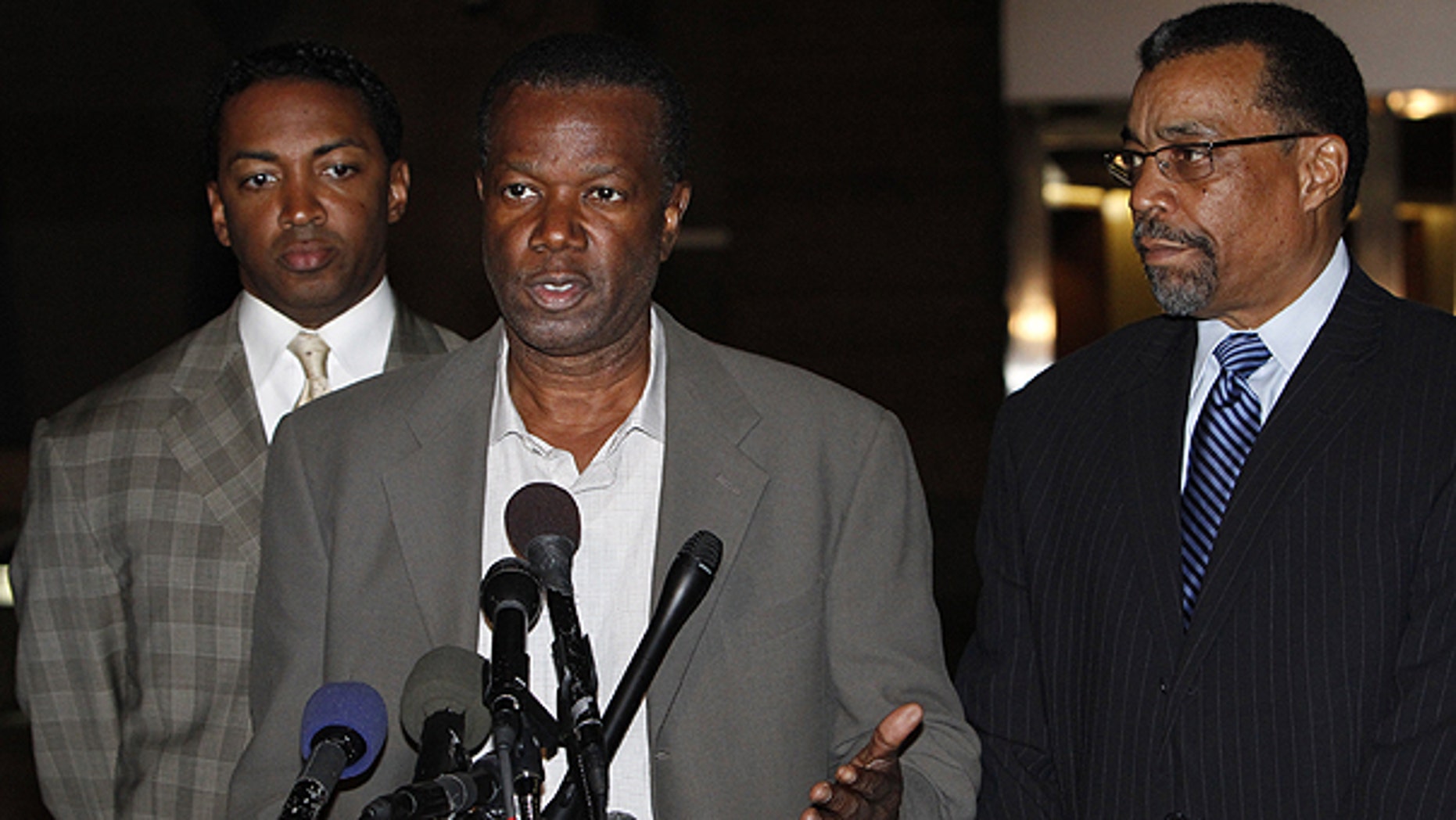 Nov. 12: Prince George's County Executive Jack Johnson, 61, center, speaks to the media with his lawyers Brian McDaniel, left, and Billy Martin, outside U.S. District Court.