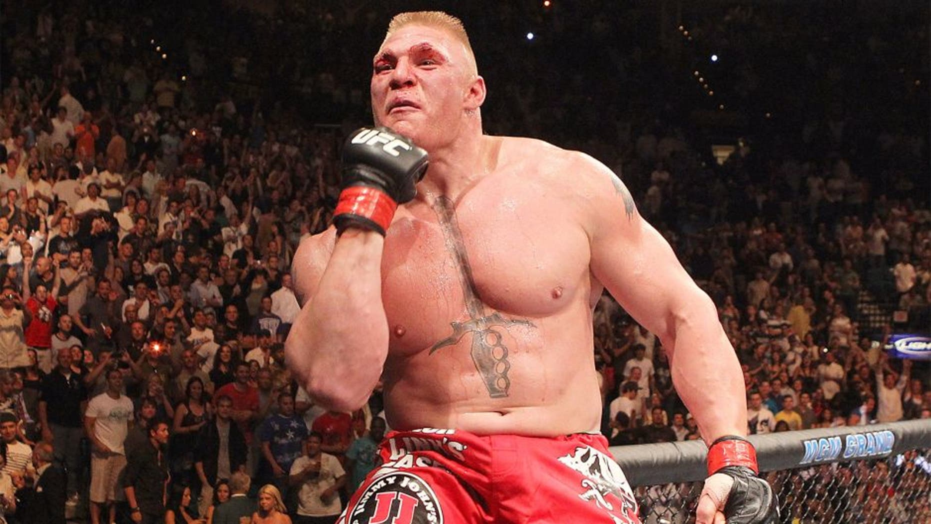 LAS VEGAS - JULY 03: Brock Lesnar reacts after his second round submission victory against Shane Carwin to win the UFC Heavyweight Championship Unification bout at the MGM Grand Garden Arena on July 3, 2010 in Las Vegas, Nevada. (Photo by Josh Hedges/Zuffa LLC/Zuffa LLC via Getty Images) *** Local Caption *** Brock Lesnar