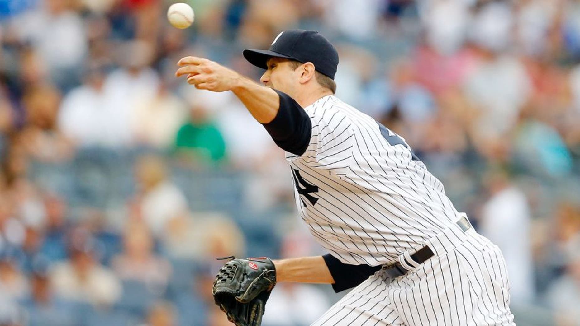 NEW YORK, NY - SEPTEMBER 12: Andrew Miller #48 of the New York Yankees in action against the Toronto Blue Jays at Yankee Stadium on September 12, 2015 in the Bronx borough of New York City. The Jays defeated the Yankees 9-5 after eleven innings. (Photo by Jim McIsaac/Getty Images)