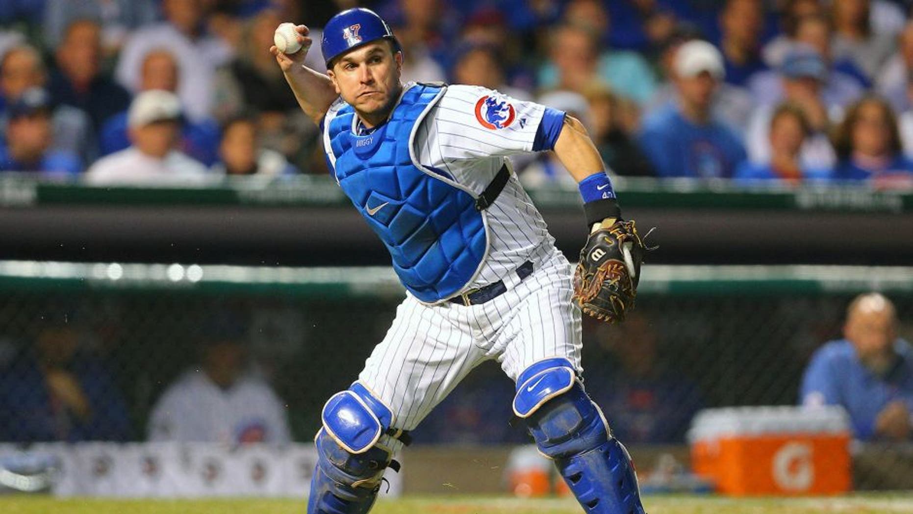October 20, 2015; Chicago, IL, USA; Chicago Cubs relief catcher Miguel Montero (47) throws to first in the sixth inning against the New York Mets in game three of the NLCS at Wrigley Field. Mandatory Credit: Dennis Wierzbicki-USA TODAY Sports