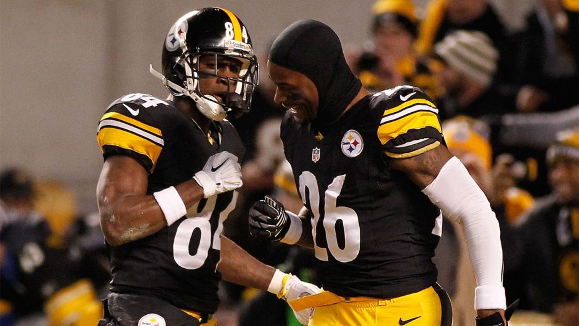 PITTSBURGH, PA - DECEMBER 28: Antonio Brown #84 of the Pittsburgh Steelers celebrates his punt return for a touchdown with Le'Veon Bell #26 during the first quarter against the Cincinnati Bengals at Heinz Field on December 28, 2014 in Pittsburgh, Pennsylvania. (Photo by Justin K. Aller/Getty Images)