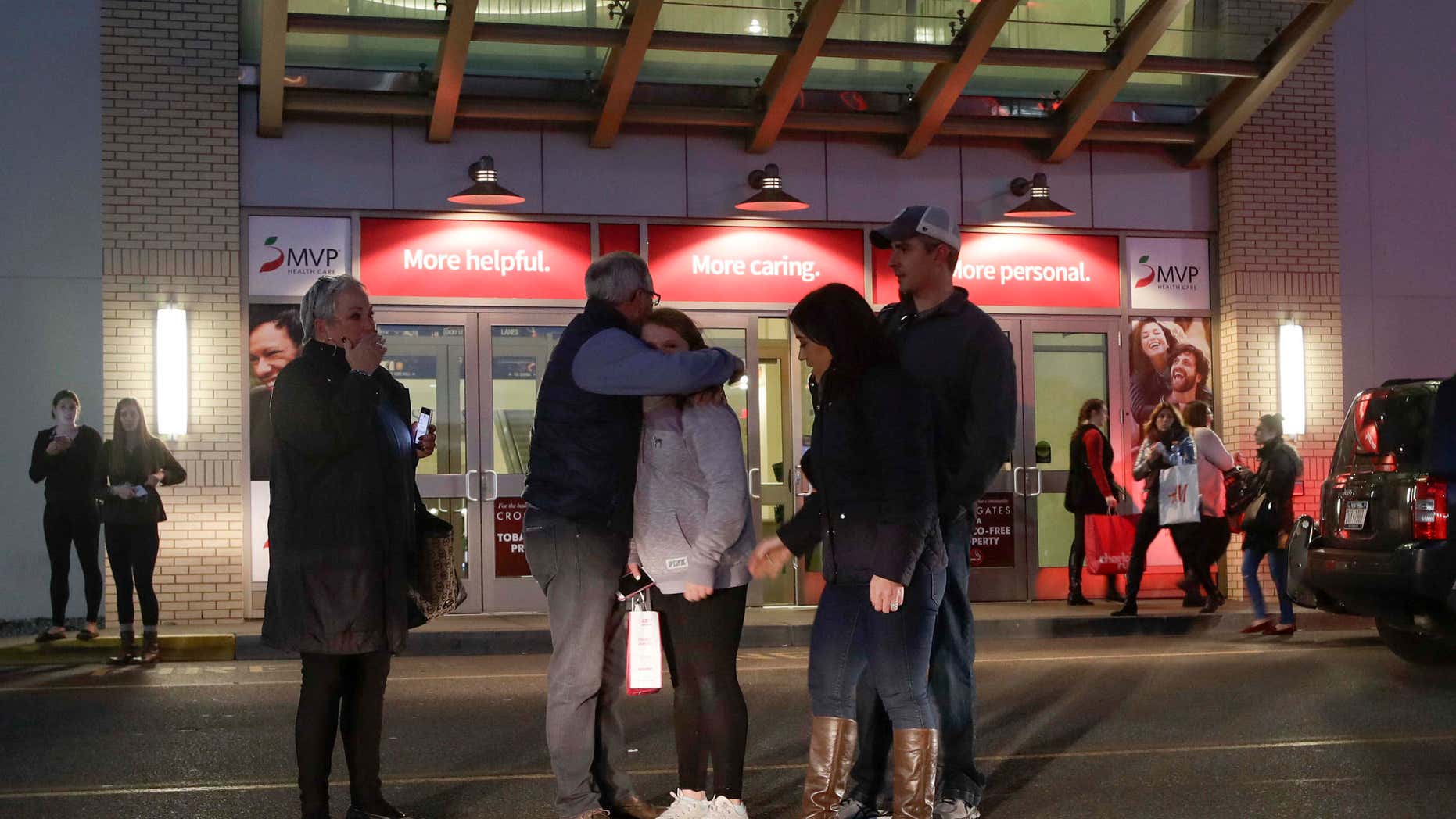 Nov. 12, 2016: People embrace after leaving Crossgates Mall in Guilderland, N.Y., after reports of gunfire inside.
