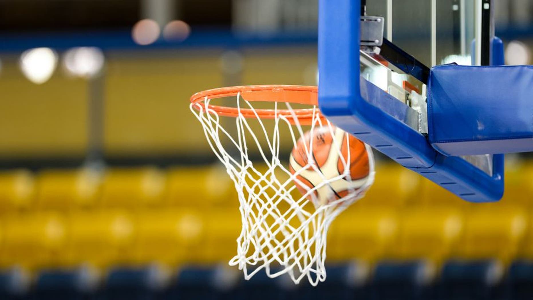 RYERSON ATHLETIC CENTRE, TORONTO, ONTARIO, CANADA - 2015/07/16: Toronto 2015 Pan Am or Pan American Games, women basketball: A Molten ball entering the net or bucket in a basketball court with empty seats. (Photo by Roberto Machado Noa/LightRocket via Getty Images)