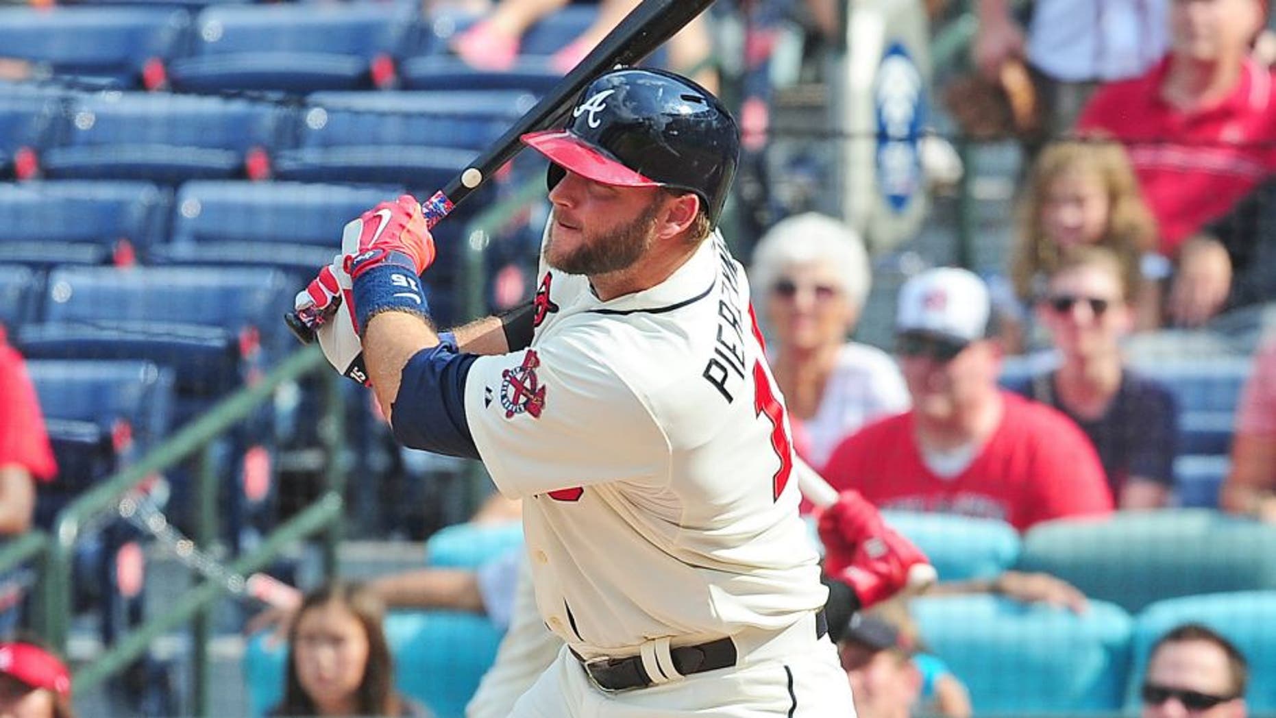 ATLANTA, GA - SEPTEMBER 20: A. J. Pierzynski #15 of the Atlanta Braves knocks in the game-winning run with a ninth inning single against the Philadelphia Philiies at Turner Field on September 20, 2015 in Atlanta, Georgia. (Photo by Scott Cunningham/Getty Images)