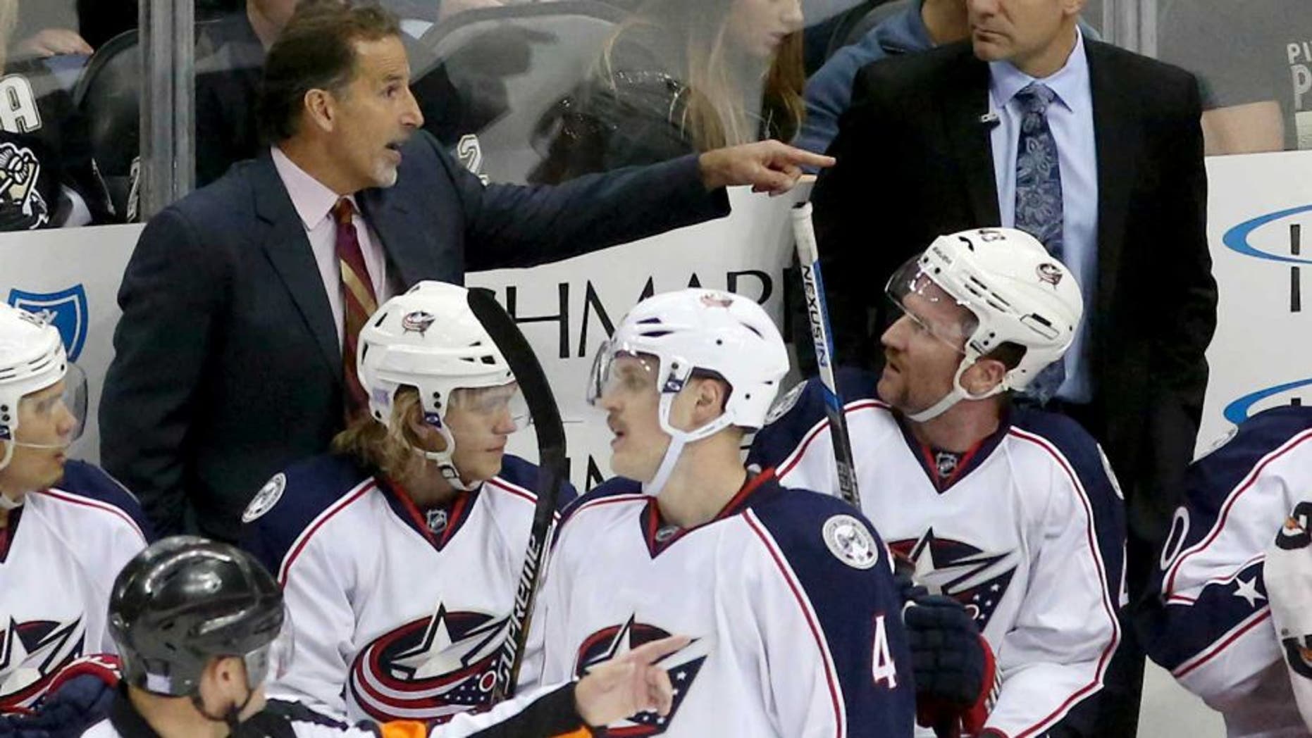 Nov 13, 2015; Pittsburgh, PA, USA; Columbus Blue Jackets head coach John Tortorella (left rear) gestures during a time-out against the Pittsburgh Penguins in the second period at the CONSOL Energy Center. The Blue Jackets won 2-1. Mandatory Credit: Charles LeClaire-USA TODAY Sports