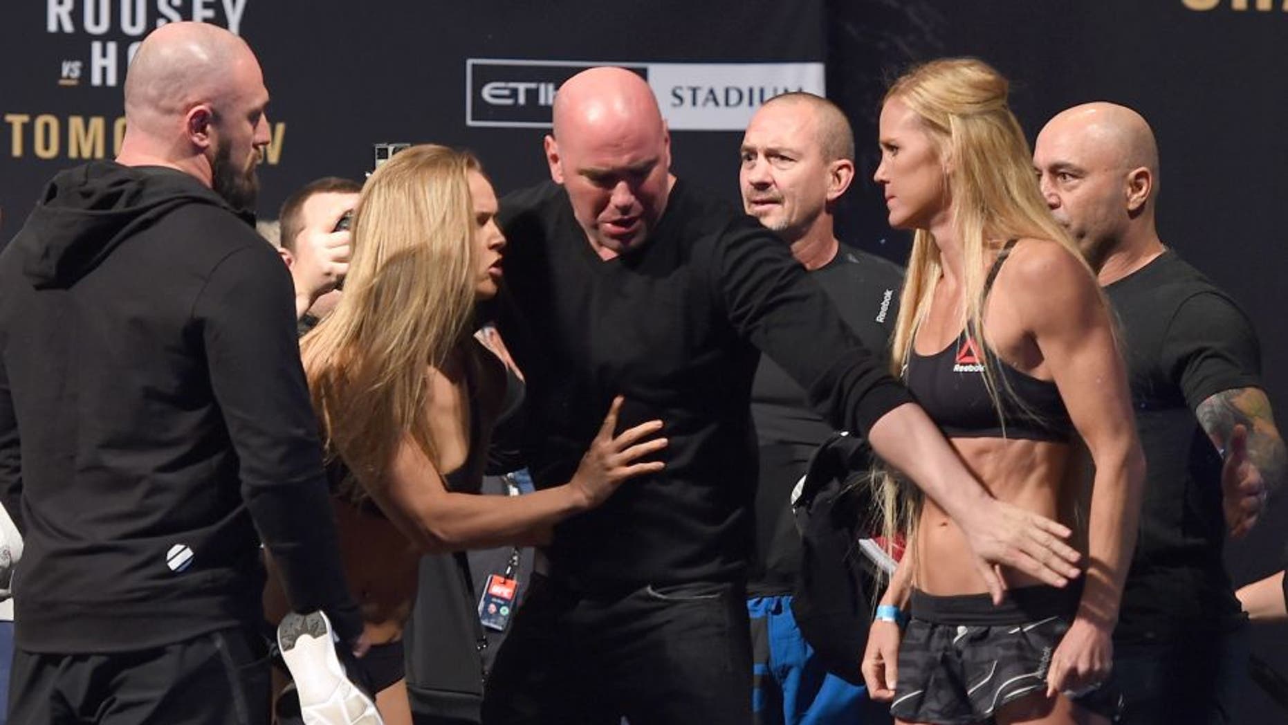 MELBOURNE, AUSTRALIA - NOVEMBER 14: (L-R) Opponents Ronda Rousey of the United States and Holly Holm of the United States face off during the UFC 193 weigh-in at Etihad Stadium on November 14, 2015 in Melbourne, Australia. (Photo by Josh Hedges/Zuffa LLC/Zuffa LLC via Getty Images)