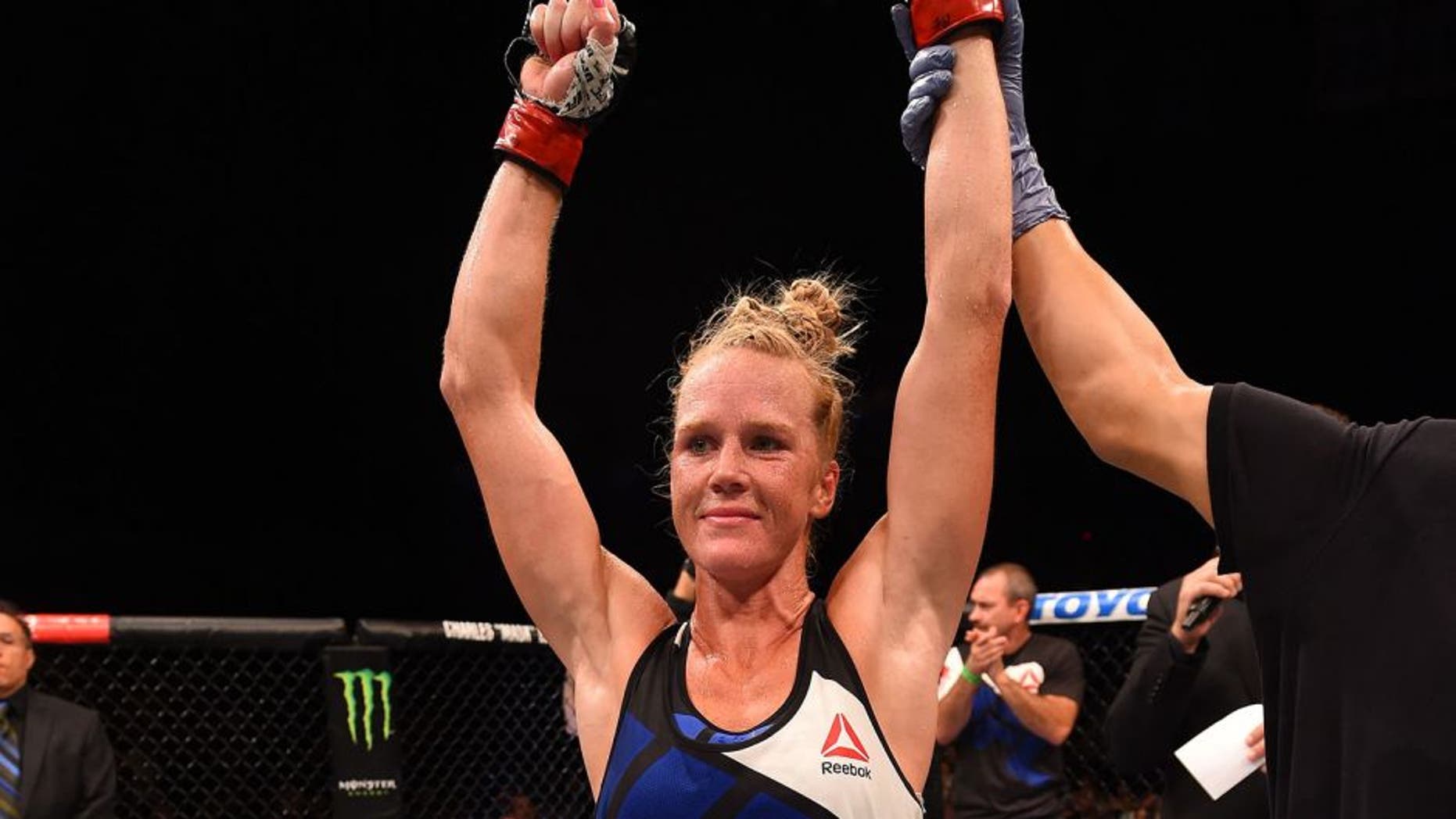 SAN DIEGO, CA - JULY 15: Holly Holm celebrates her victory over Marion Reneau in their women's bantamweight bout during the UFC event at the Valley View Casino Center on July 15, 2015 in San Diego, California. (Photo by Jeff Bottari/Zuffa LLC/Zuffa LLC via Getty Images)