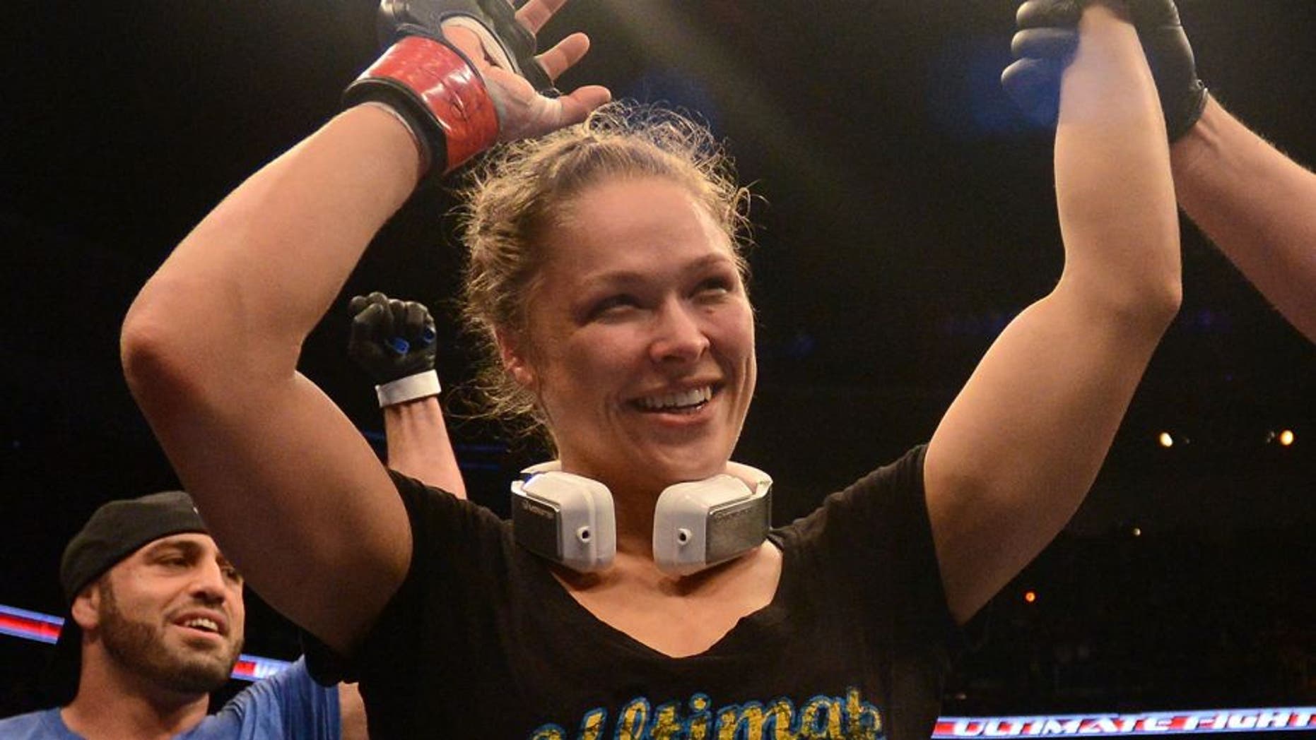 ANAHEIM, CA - FEBRUARY 23: Ronda Rousey reacts to her victory over Liz Carmouche in their women's bantamweight title fight during UFC 157 at Honda Center on February 23, 2013 in Anaheim, California. (Photo by Donald Miralle/Zuffa LLC/Zuffa LLC via Getty Images)