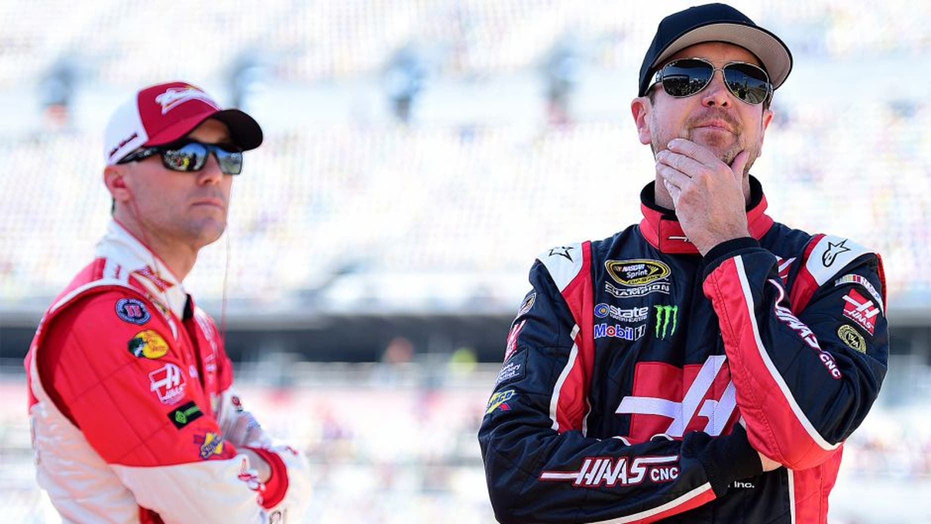 DAYTONA BEACH, FL - FEBRUARY 15: Kevin Harvick, driver of the #4 Budweiser/Jimmy John's Chevrolet, and Kurt Busch, driver of the #41 Haas Automation Chevrolet, stands on the grid during qualifying for the 57th Annual Daytona 500 at Daytona International Speedway on February 15, 2015 in Daytona Beach, Florida. (Photo by Robert Laberge/NASCAR via Getty Images)