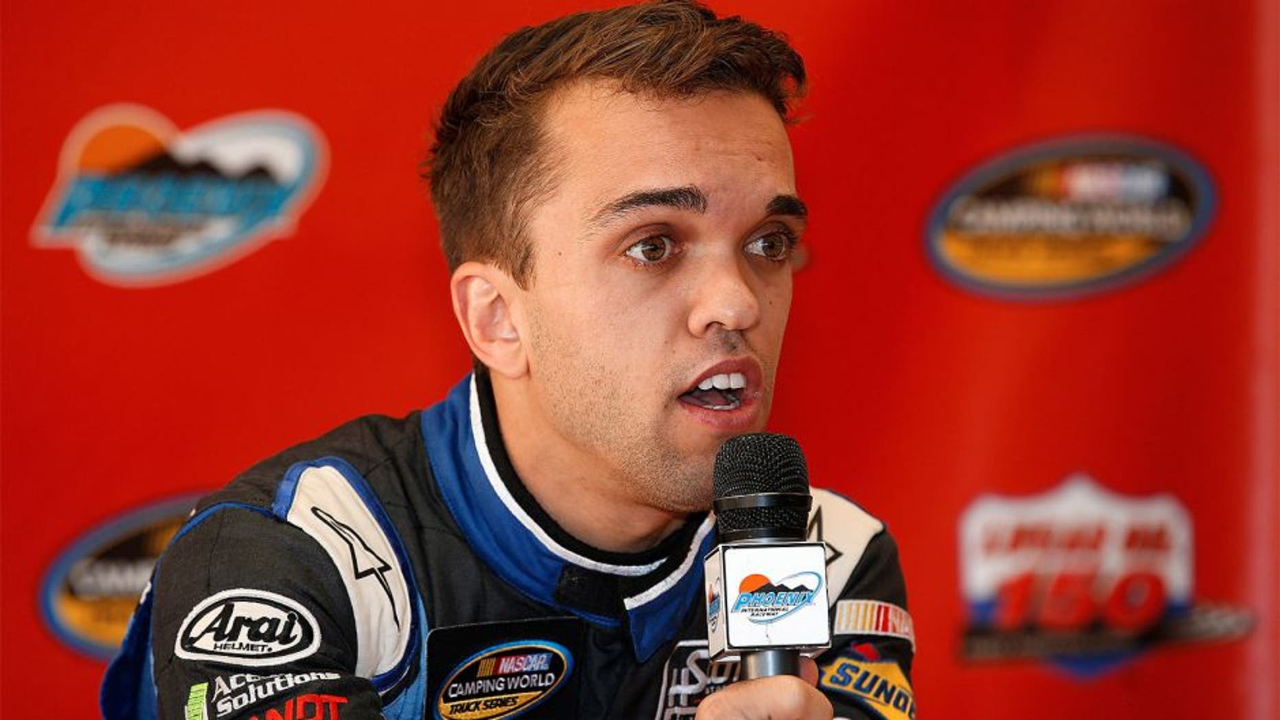 AVONDALE, AZ - NOVEMBER 13: Rico Abreu, driver of the #31 AccuDoc Solutions Chevrolet, speaks to the media before practice for the NASCAR Camping World Truck Series Lucas Oil 150 at Phoenix International Raceway on November 13, 2015 in Avondale, Arizona. (Photo by Todd Warshaw/Getty Images)