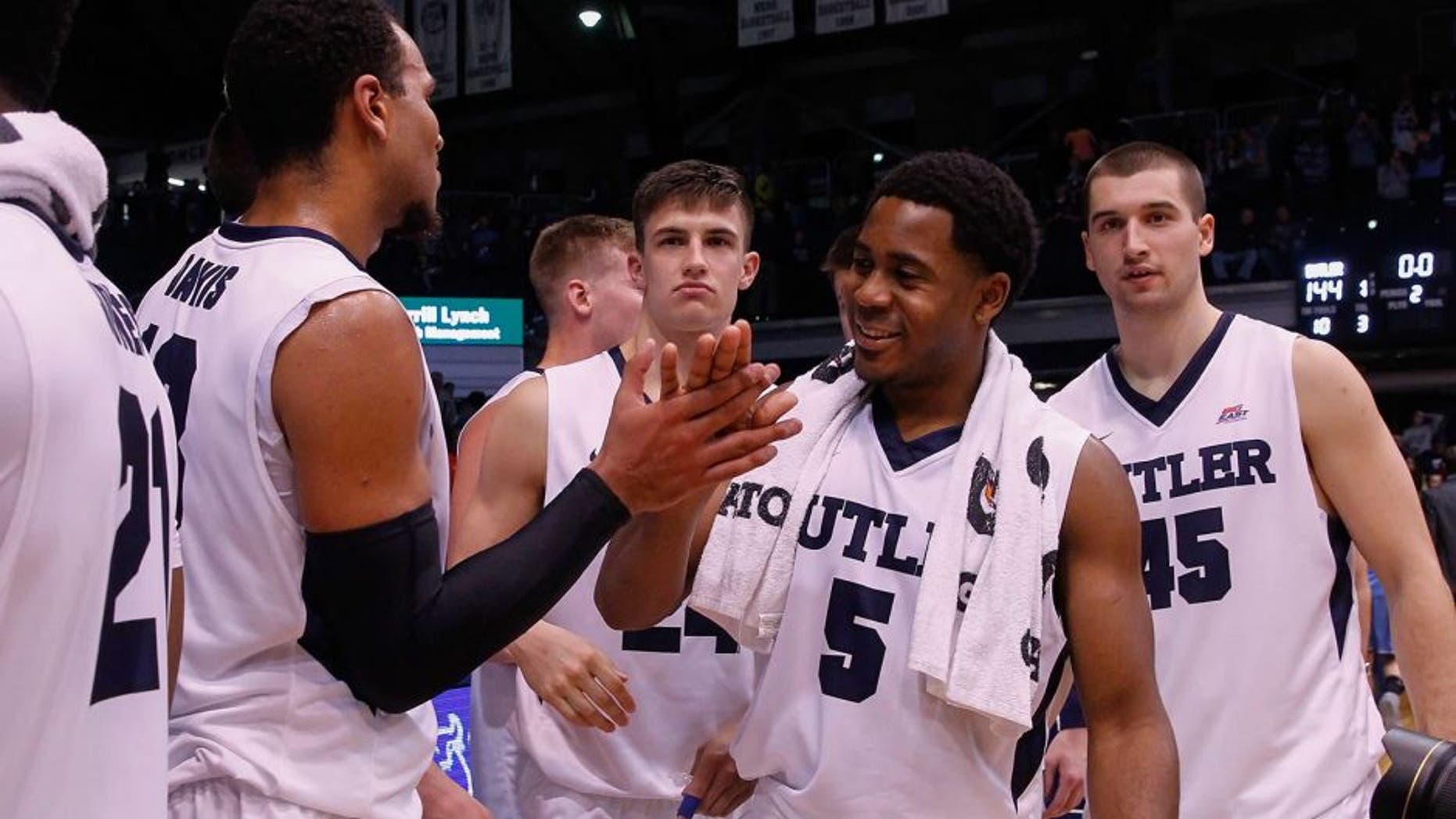 INDIANAPOLIS, IN - NOVEMBER 14: Jordan Gathers #5 of the Butler Bulldogs and members of the Butler Bulldogs celebrate an NCAA record for points scored after defeating Citadel 144-71 at Hinkle Fieldhouse on November 14, 2015 in Indianapolis, Indiana. (Photo by Michael Hickey/Getty Images)
