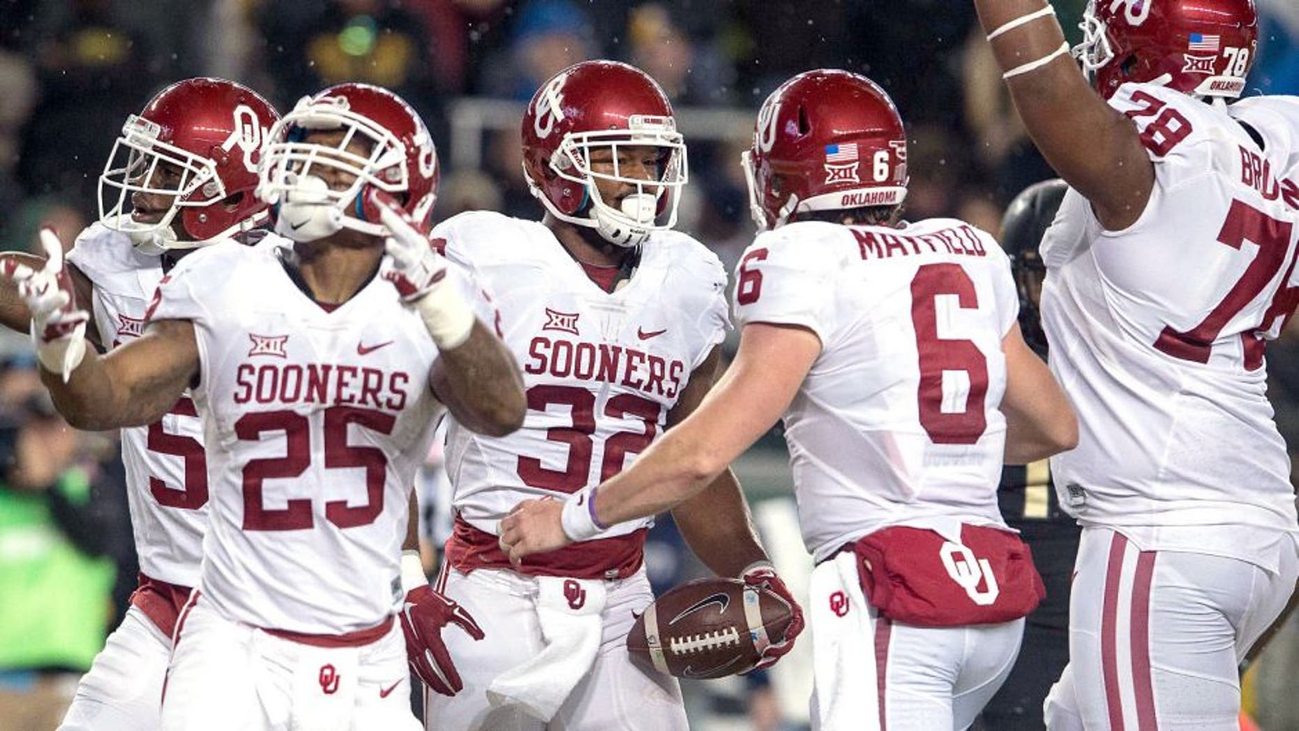 Nov 14, 2015; Waco, TX, USA; Oklahoma Sooners wide receiver Sterling Shepard (3) and running back Joe Mixon (25) and running back Samaje Perine (32) and quarterback Baker Mayfield (6) celebrate Perine's touchdown against the Baylor Bears during the first quarter at McLane Stadium. Mandatory Credit: Jerome Miron-USA TODAY Sports