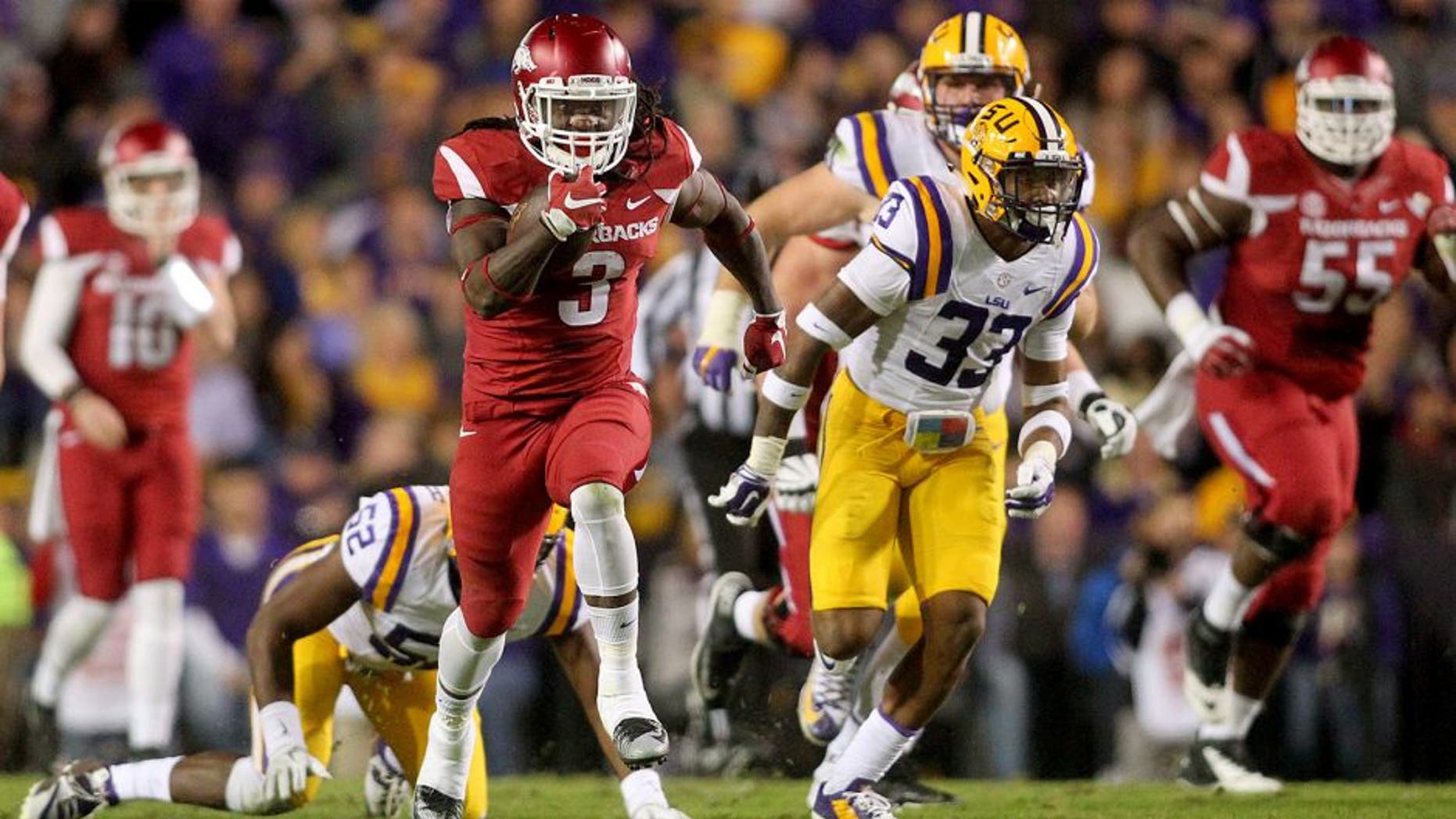 Nov 14, 2015; Baton Rouge, LA, USA; Arkansas Razorbacks running back Alex Collins (3) carries the ball to score a touchdown against the LSU Tigers in the first half at Tiger Stadium. Mandatory Credit: Crystal LoGiudice-USA TODAY Sports