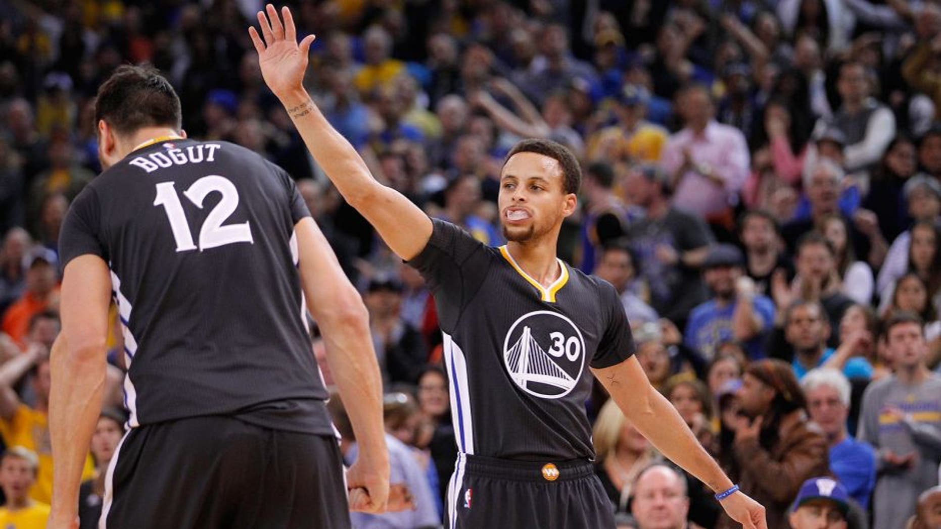 Nov 14, 2015; Oakland, CA, USA; Golden State Warriors guard Stephen Curry (30) reacts after the Warriors force a turnover against the Brooklyn Nets in overtime at Oracle Arena. The Warriors defeated the Nets 107-99. Mandatory Credit: Cary Edmondson-USA TODAY Sports