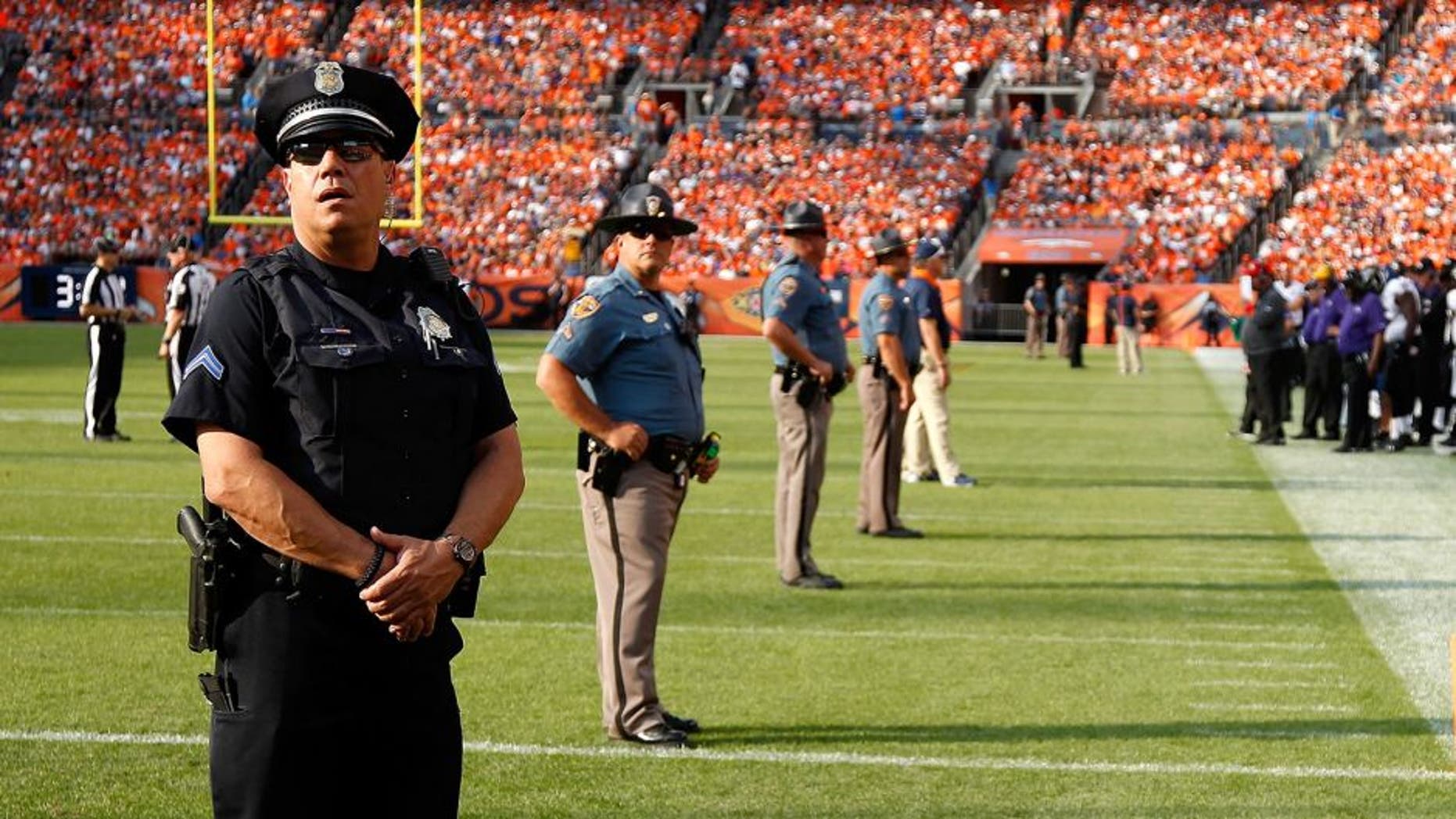 DENVER, CO - SEPTEMBER 13: Law enforcement officers provide security on the field during a break in the action between the Baltimore Ravens and the Denver Broncos at Sports Authority Field at Mile High on September 13, 2015 in Denver, Colorado. The Broncos defeated the Ravens 19-13. (Photo by Doug Pensinger/Getty Images)