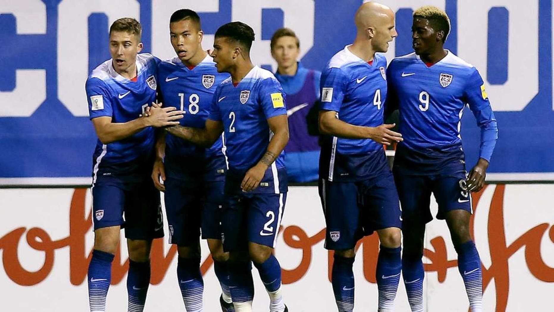 Nov 13, 2015; St.Louis, MO, USA; USA forward Bobby Wood (18) is congratulated by teammates after scoring during the first half of a FIFA World Cup Qualifying soccer match St. Vincent & The Grenadines at Busch Stadium. USA won 6-1. Mandatory Credit: Scott Kane-USA TODAY Sports