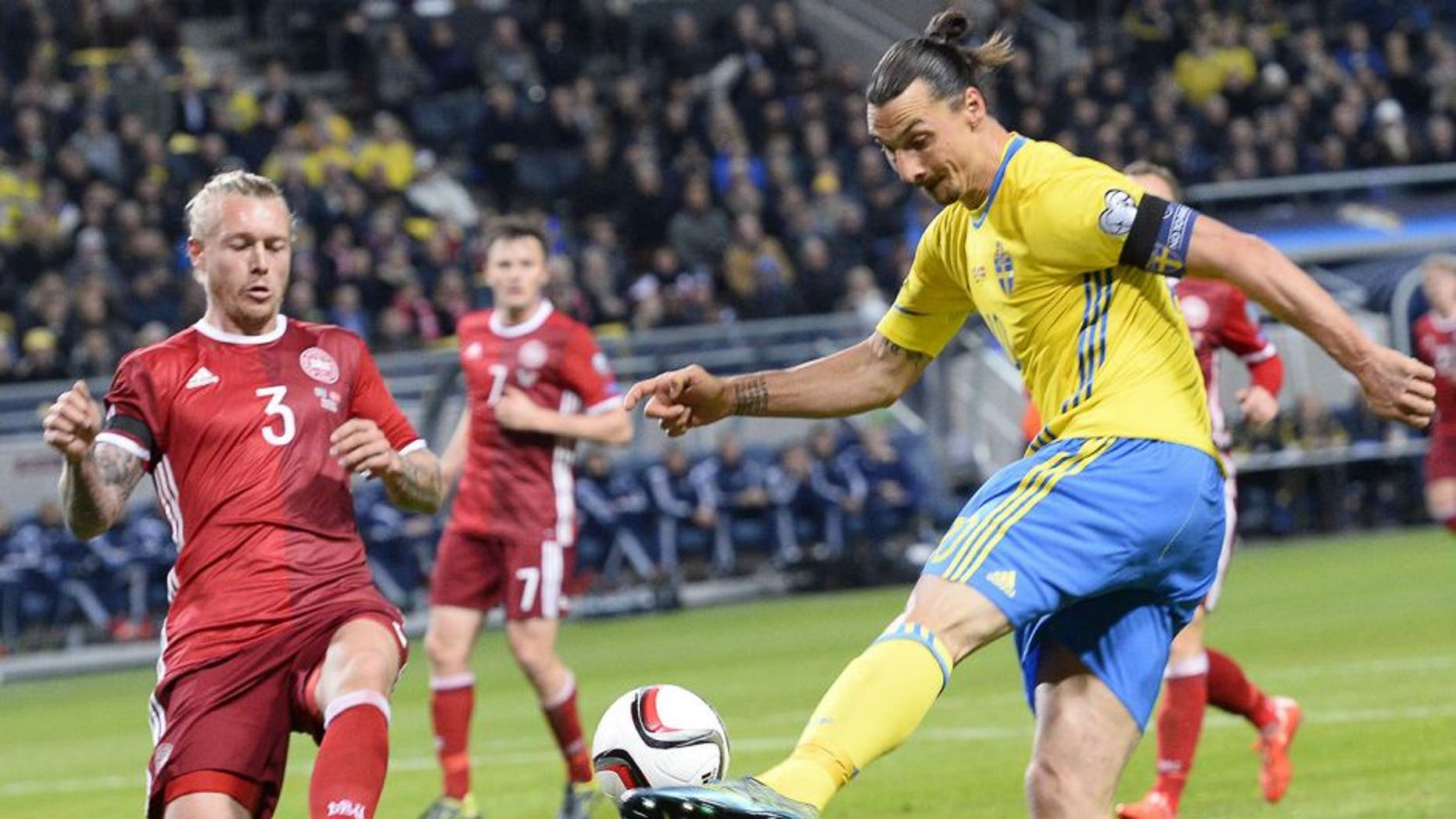 Denmark's defender Simon Kjaer (L) reacts as Sweden's forward and team captain Zlatan Ibrahimovic (r) shoots during the Euro 2016 play-off football match between Sweden and Denmark at the Friends arena in Solna on November 14, 2015. AFP PHOTO / JONATHAN NACKSTRAND (Photo credit should read JONATHAN NACKSTRAND/AFP/Getty Images)