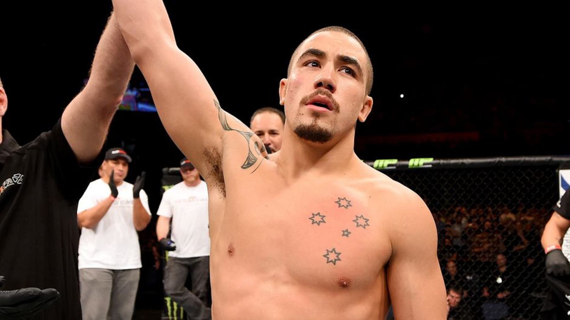 ADELAIDE, AUSTRALIA - MAY 10: Robert Whittaker celebrates his knockout victory over Brad Tavares in their middleweight bout during the UFC Fight Night event at the Adelaide Entertainment Centre on May 10, 2015 in Adelaide, Australia. (Photo by Josh Hedges/Zuffa LLC/Zuffa LLC via Getty Images)