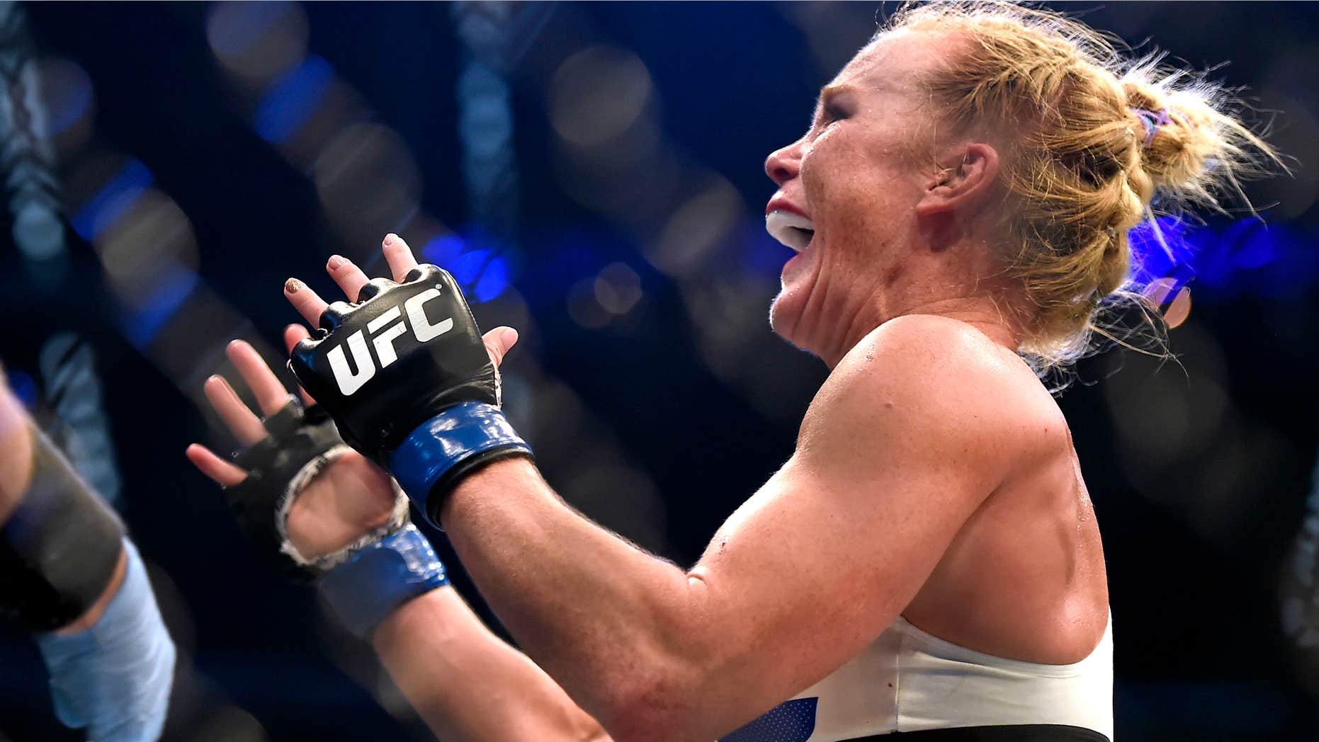Nov. 15, 2015: Holly Holm celebrates after defeating Ronda Rousey during their UFC 193 bantamweight title fight in Melbourne, Australia