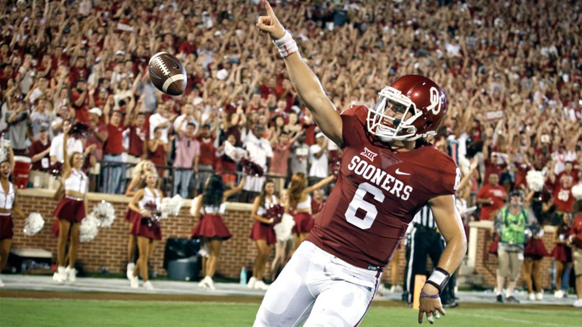 NORMAN, OK - SEPTEMBER 5: Quarterback Baker Mayfield #6 of the Oklahoma Sooners celebrates a touchdown against the Akron Zips September 5, 2015 at Gaylord Family-Oklahoma Memorial Stadium in Norman, Oklahoma. Oklahoma defeated Akron 41-3.(Photo by Brett Deering/Getty Images)